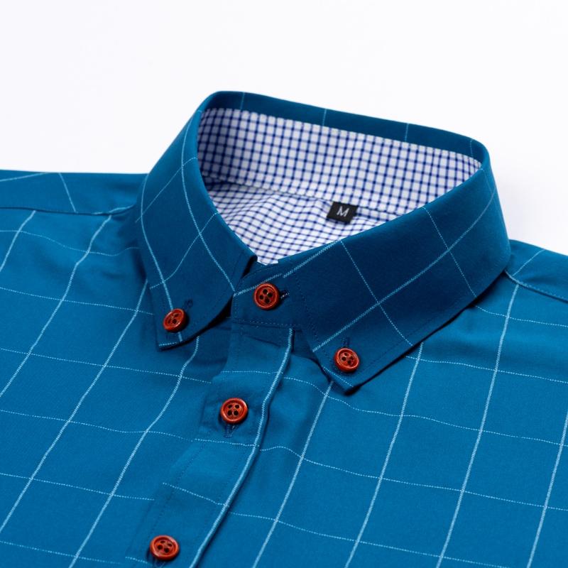 Men&rsquo;s short-sleeve shirt with four panels and color-block contrast collar, urban casual style. Turn-down collar with contrasting plaid lining, orange button front, and a slim fit. Smooth fabric drapes comfortably, with a tailored silhouette that flatters