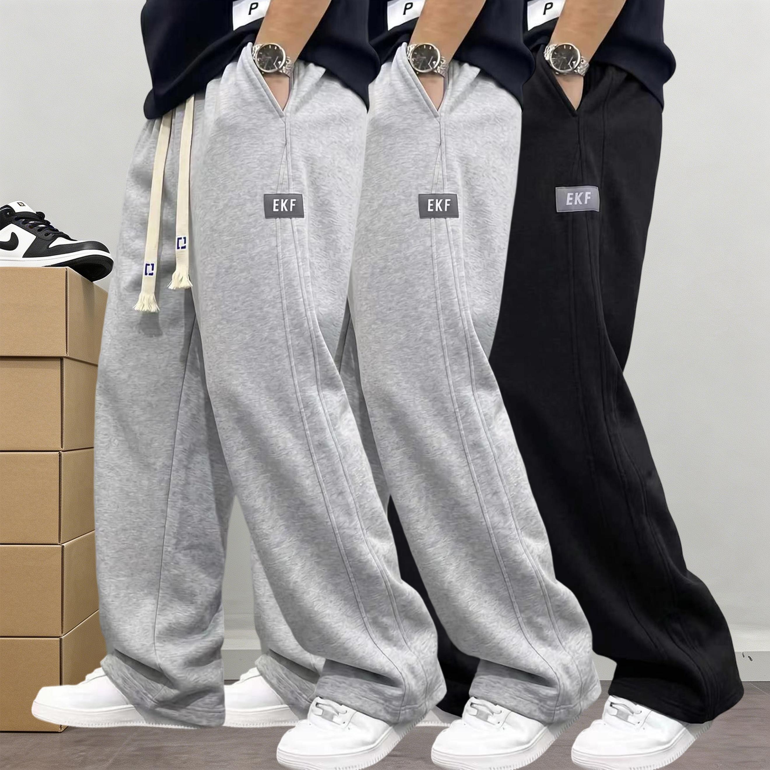 Men&rsquo;s 3-pack cotton joggers with drawstring elastic waist and wide legs; relaxed, drapey straight cut with practical side pockets; American street style; versatile casual pants for everyday commuting, sports, and streetwear.