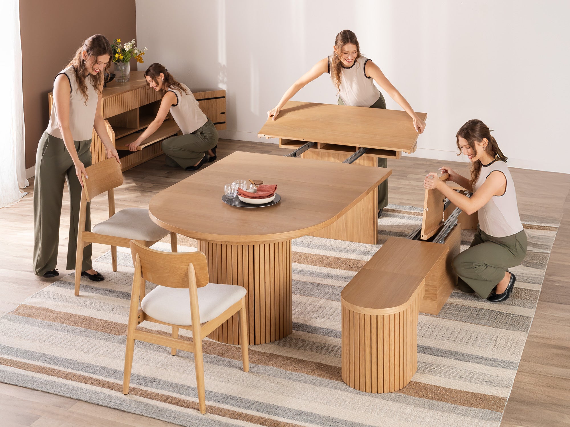 Versatile expandable dining table seats 4‑10, robust hardwood‑steel build, hidden pedestal storage and elegant fluted detailing for flexible everyday dining.