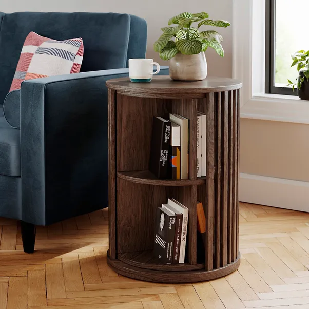 Stylish wood-effect rotating bookcase, space-saving and multi-functional. It doubles as a practical side table, featuring smooth rotation for easy access to books and decor to tidy up your home.
