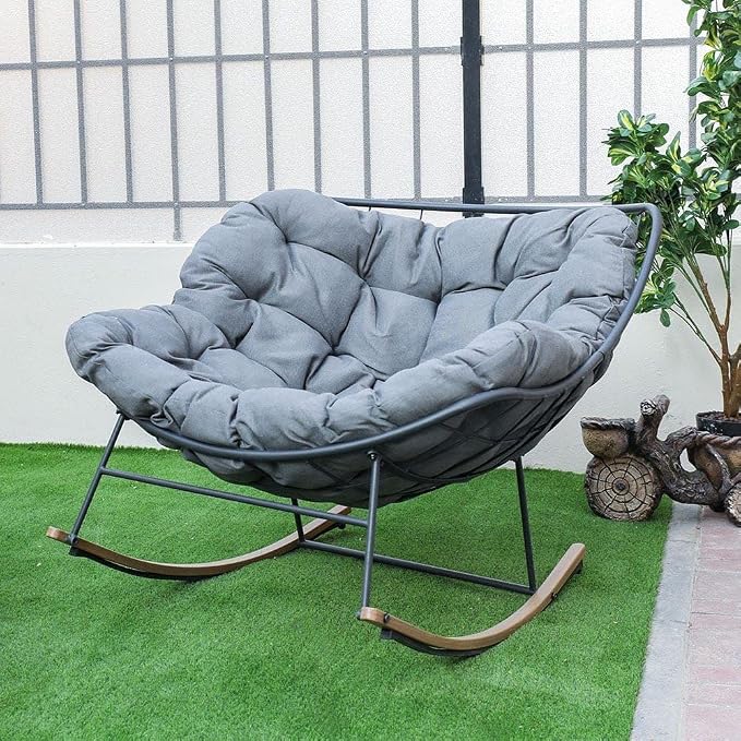 This egg‑shaped rocking chair with stain‑resistant padded cushion and powder‑coated steel frame suits indoor‑outdoor relaxation, holding up to 350 lbs.