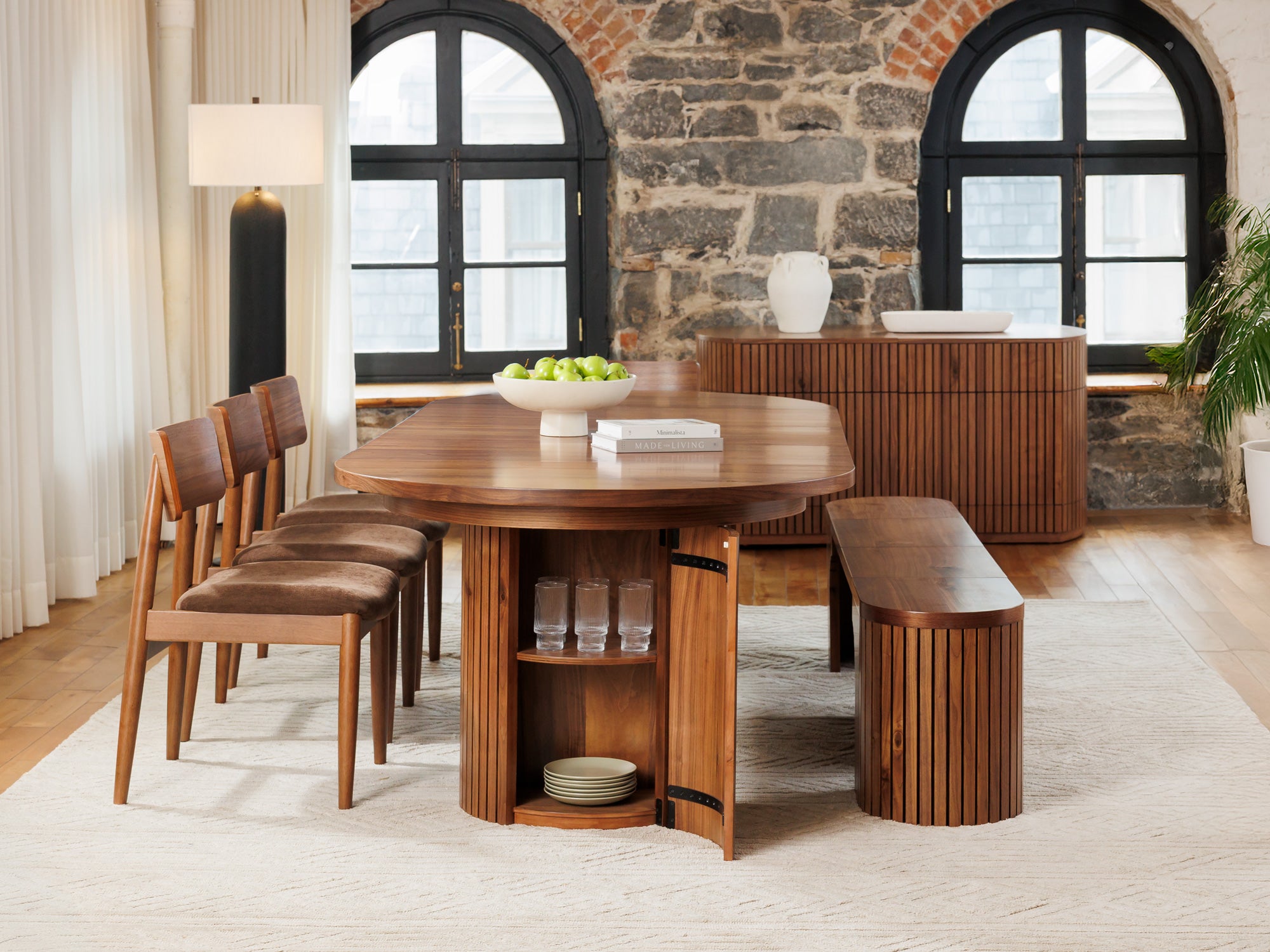 Versatile expandable dining table seats 4‑10, robust hardwood‑steel build, hidden pedestal storage and elegant fluted detailing for flexible everyday dining.