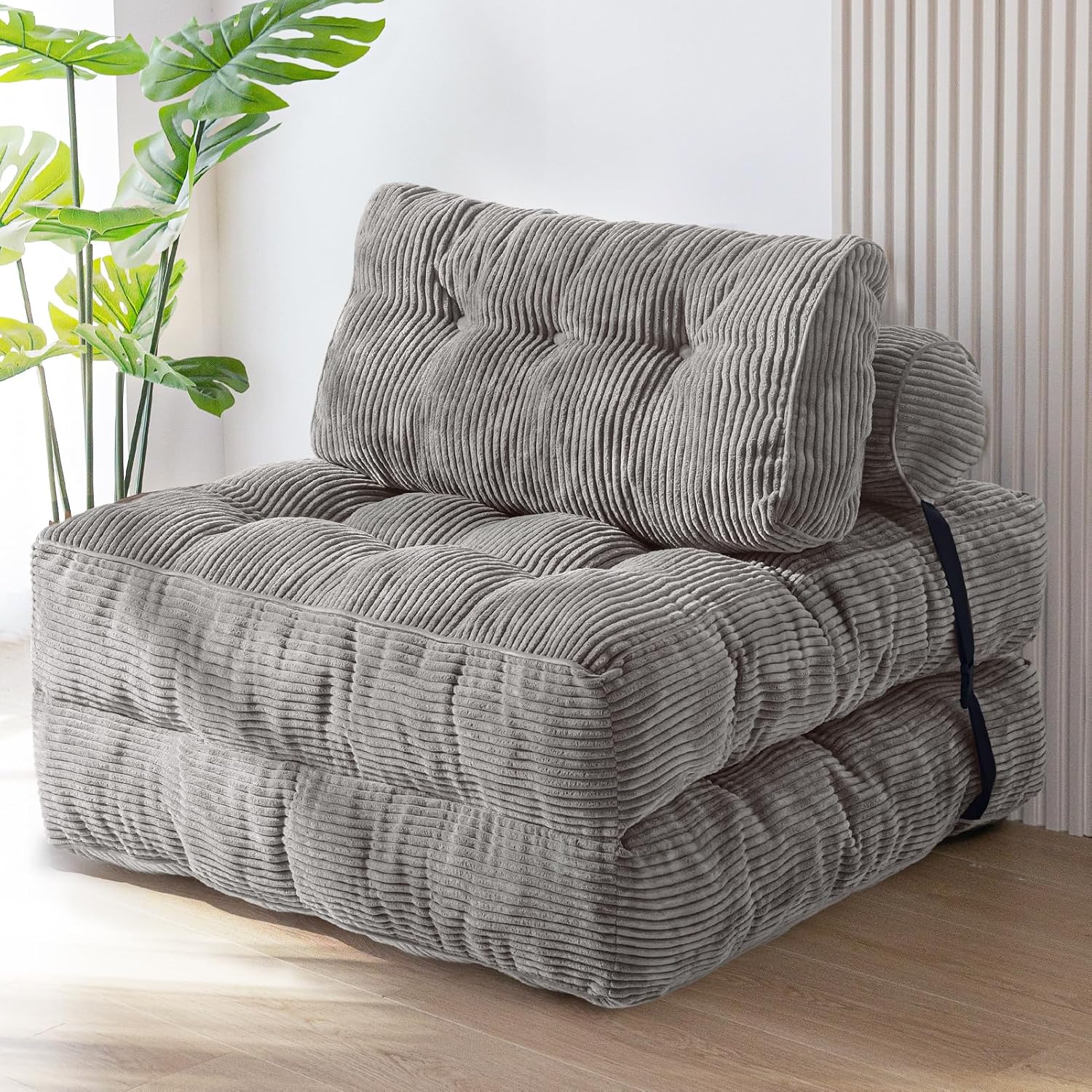 Practical folding sofa‑bed with headrest and lumbar support, comfy foam filling, compact multi‑use furniture for small living spaces and overnight guests.