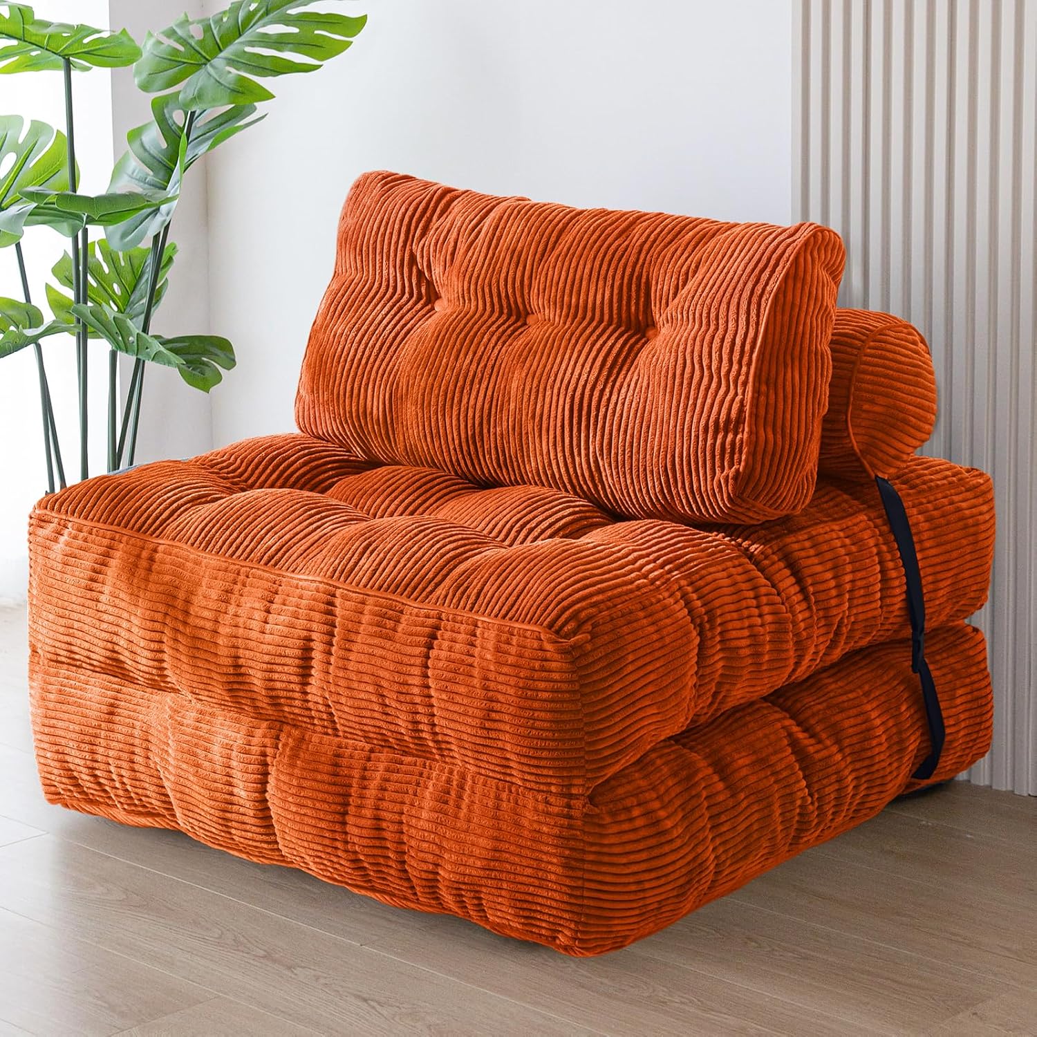 Practical folding sofa‑bed with headrest and lumbar support, comfy foam filling, compact multi‑use furniture for small living spaces and overnight guests.