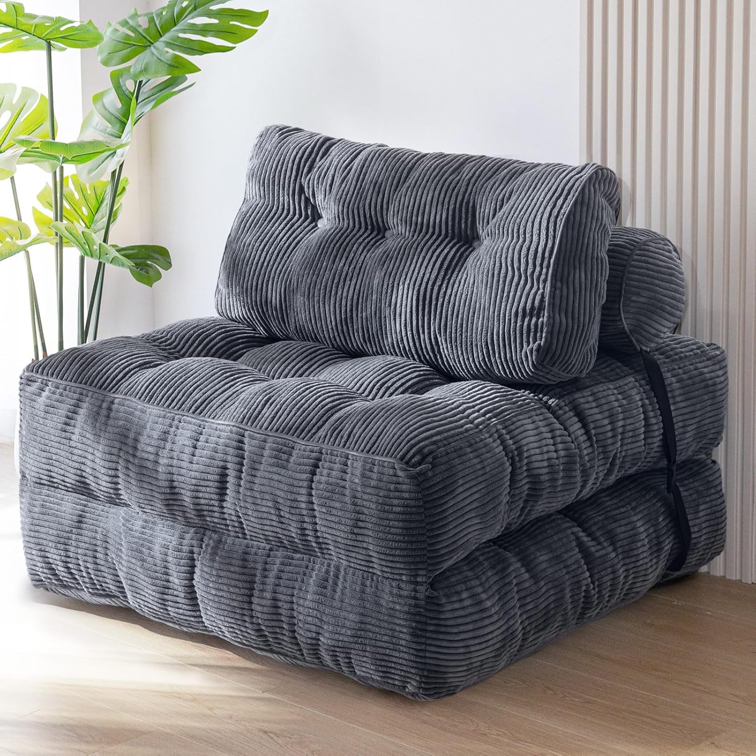 Practical folding sofa‑bed with headrest and lumbar support, comfy foam filling, compact multi‑use furniture for small living spaces and overnight guests.