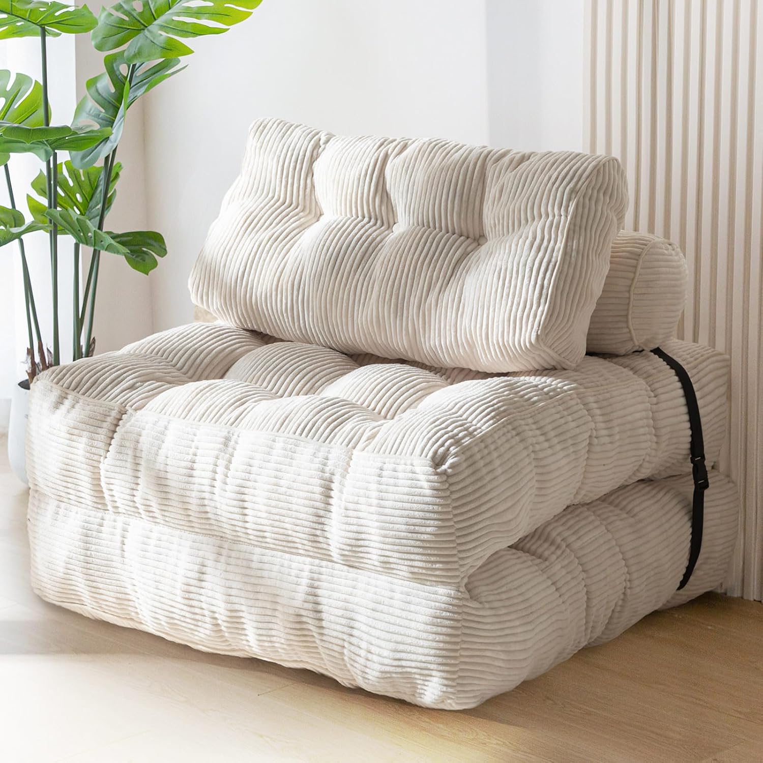 Practical folding sofa‑bed with headrest and lumbar support, comfy foam filling, compact multi‑use furniture for small living spaces and overnight guests.