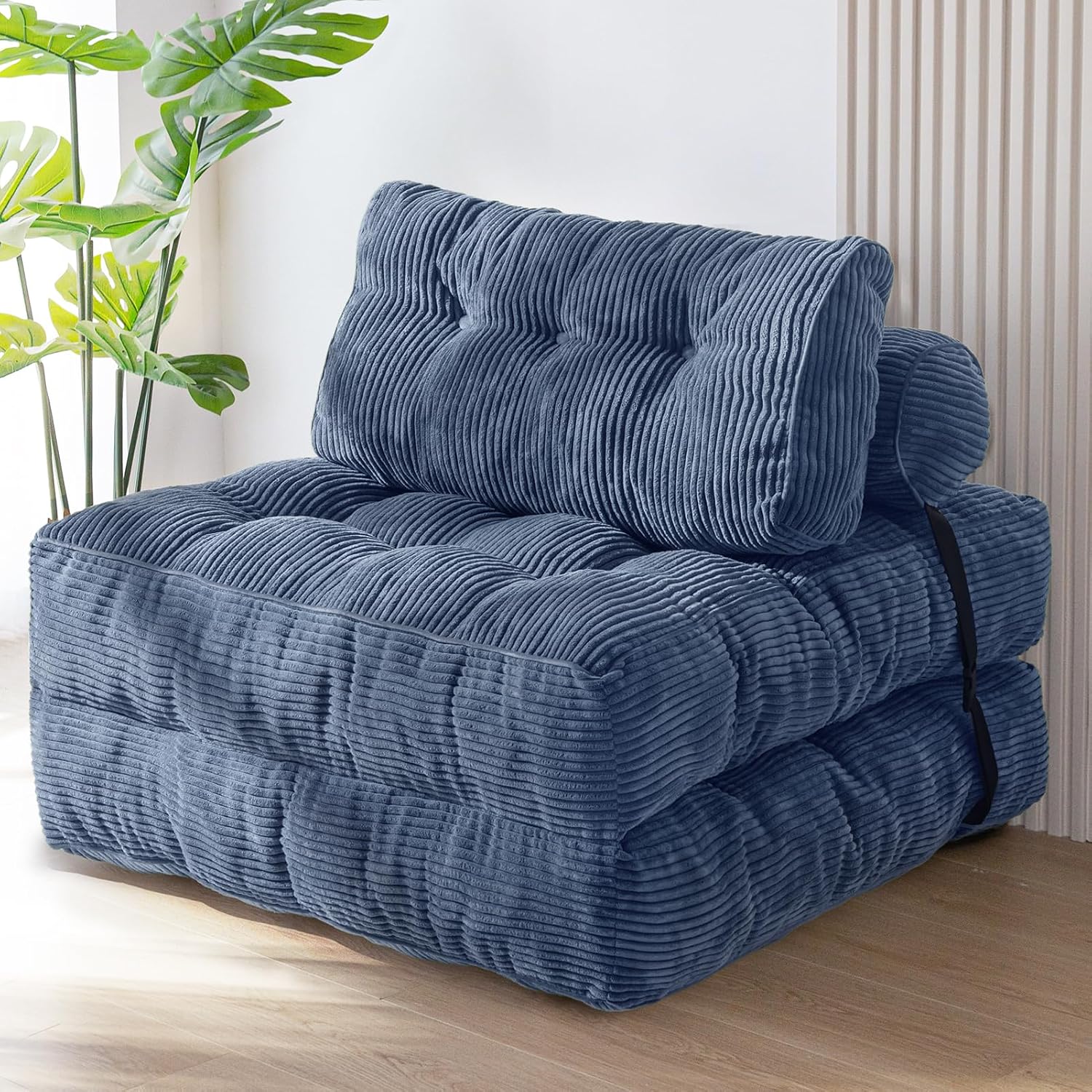 Practical folding sofa‑bed with headrest and lumbar support, comfy foam filling, compact multi‑use furniture for small living spaces and overnight guests.