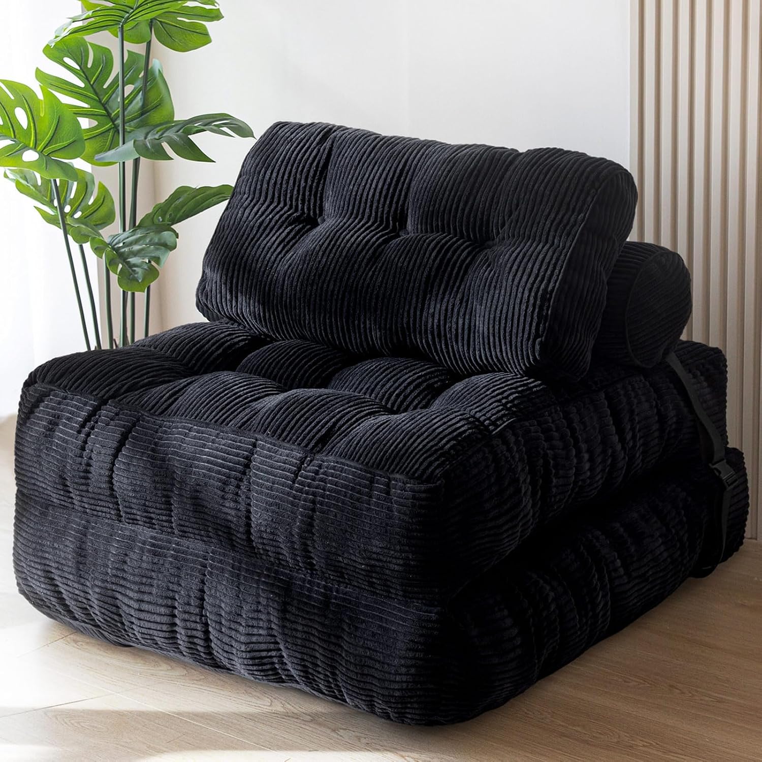 Practical folding sofa‑bed with headrest and lumbar support, comfy foam filling, compact multi‑use furniture for small living spaces and overnight guests.