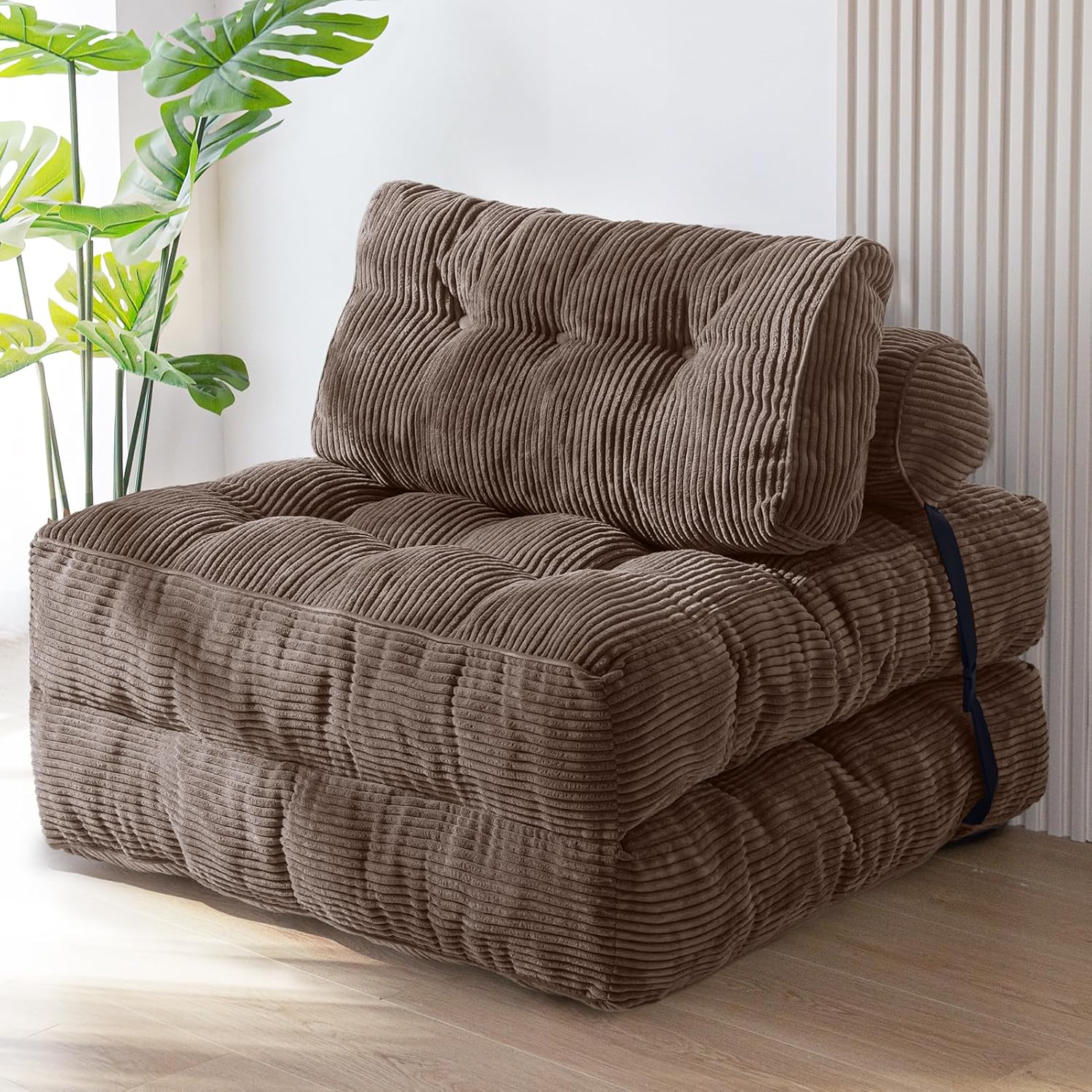 Practical folding sofa‑bed with headrest and lumbar support, comfy foam filling, compact multi‑use furniture for small living spaces and overnight guests.