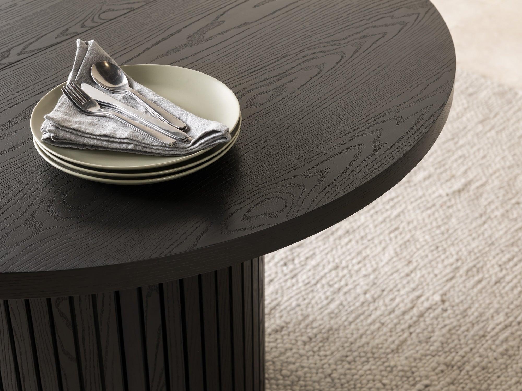 Versatile expandable dining table seats 4‑10, robust hardwood‑steel build, hidden pedestal storage and elegant fluted detailing for flexible everyday dining.