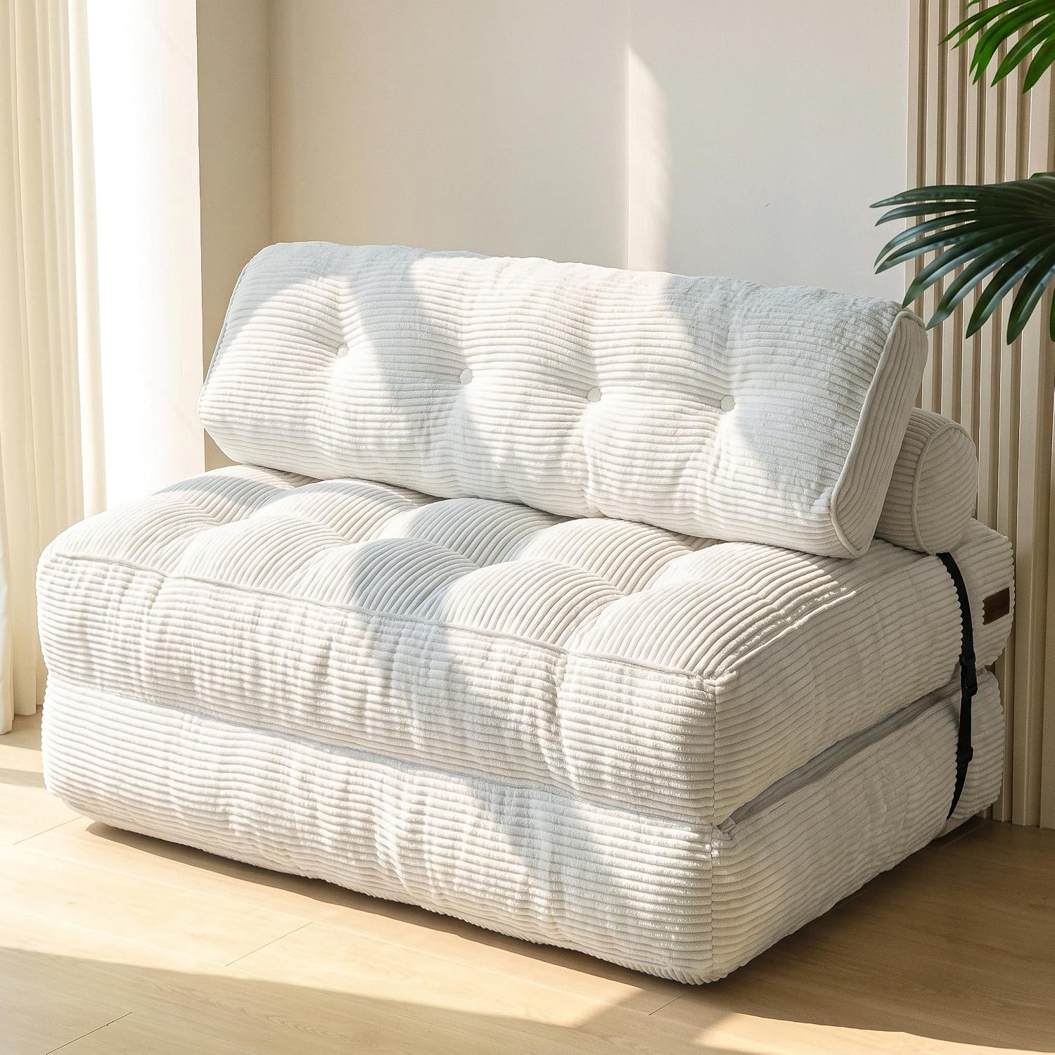 Practical folding sofa‑bed with headrest and lumbar support, comfy foam filling, compact multi‑use furniture for small living spaces and overnight guests.