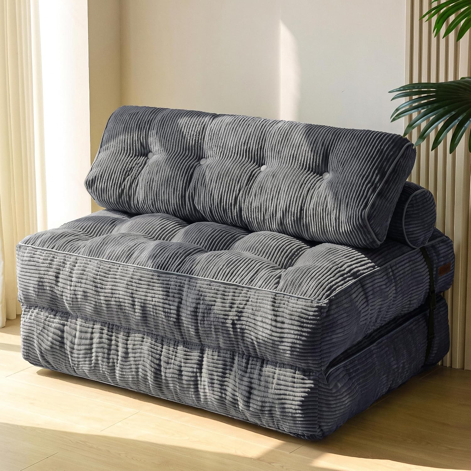 Practical folding sofa‑bed with headrest and lumbar support, comfy foam filling, compact multi‑use furniture for small living spaces and overnight guests.
