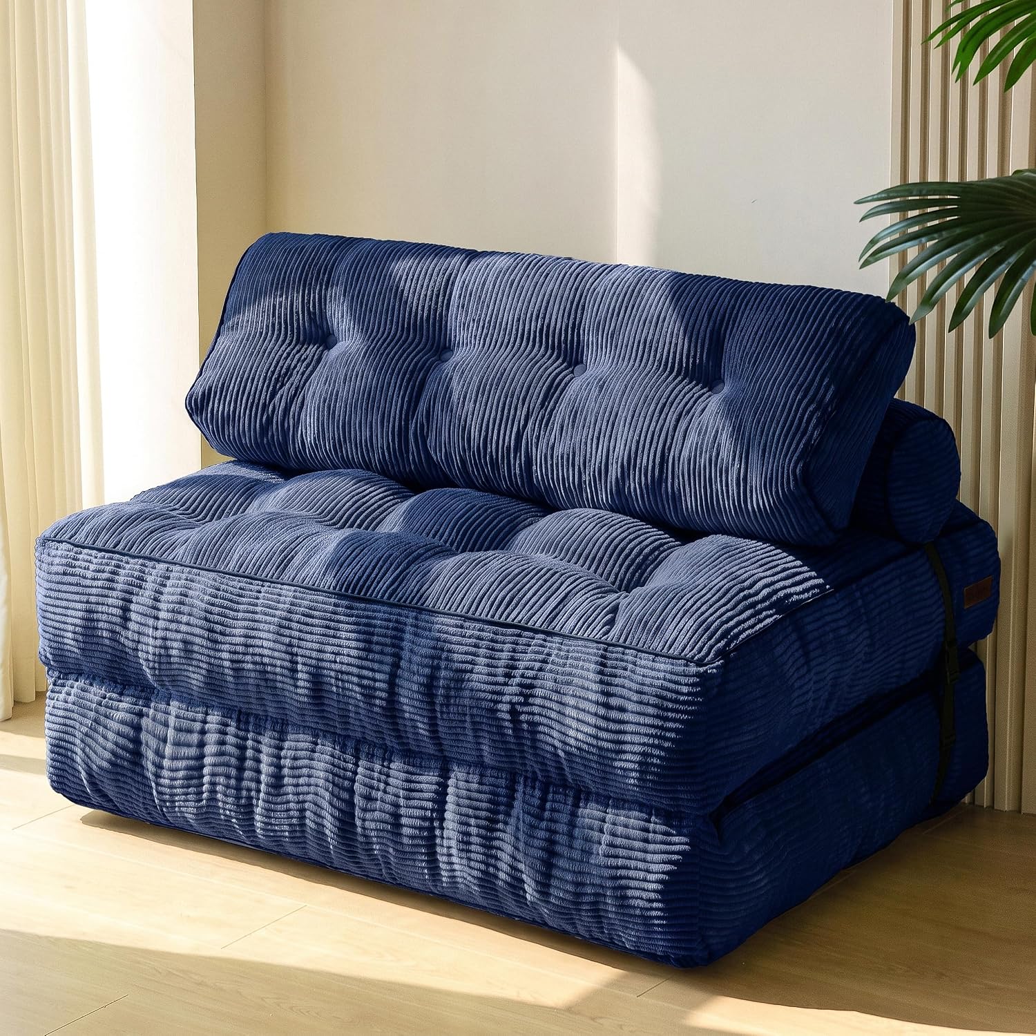 Practical folding sofa‑bed with headrest and lumbar support, comfy foam filling, compact multi‑use furniture for small living spaces and overnight guests.