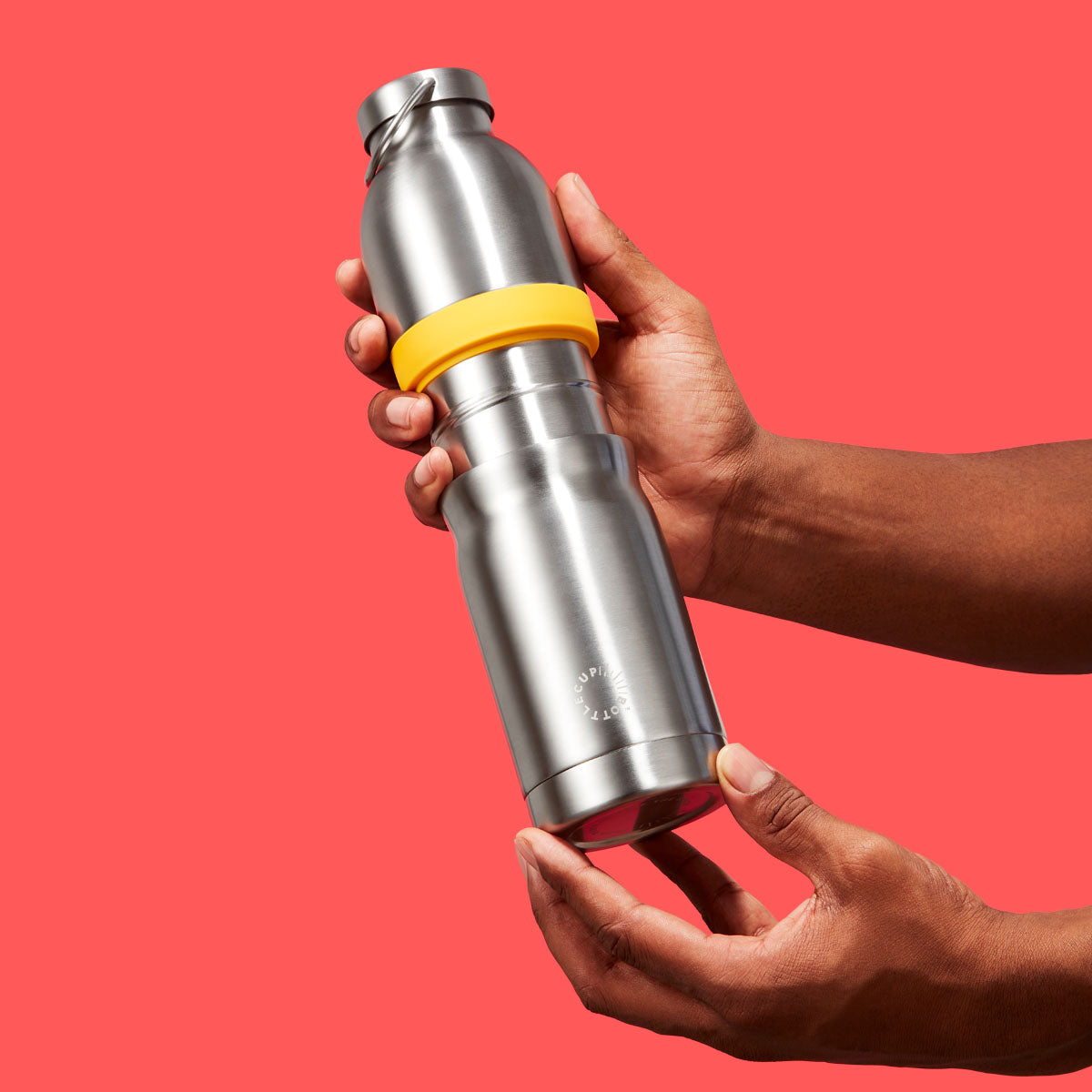 2‑in‑1 reusable insulated water bottle & coffee cup with hidden stored lid, modular build, keeps drinks hot or cold for travel and on‑the‑go use. 