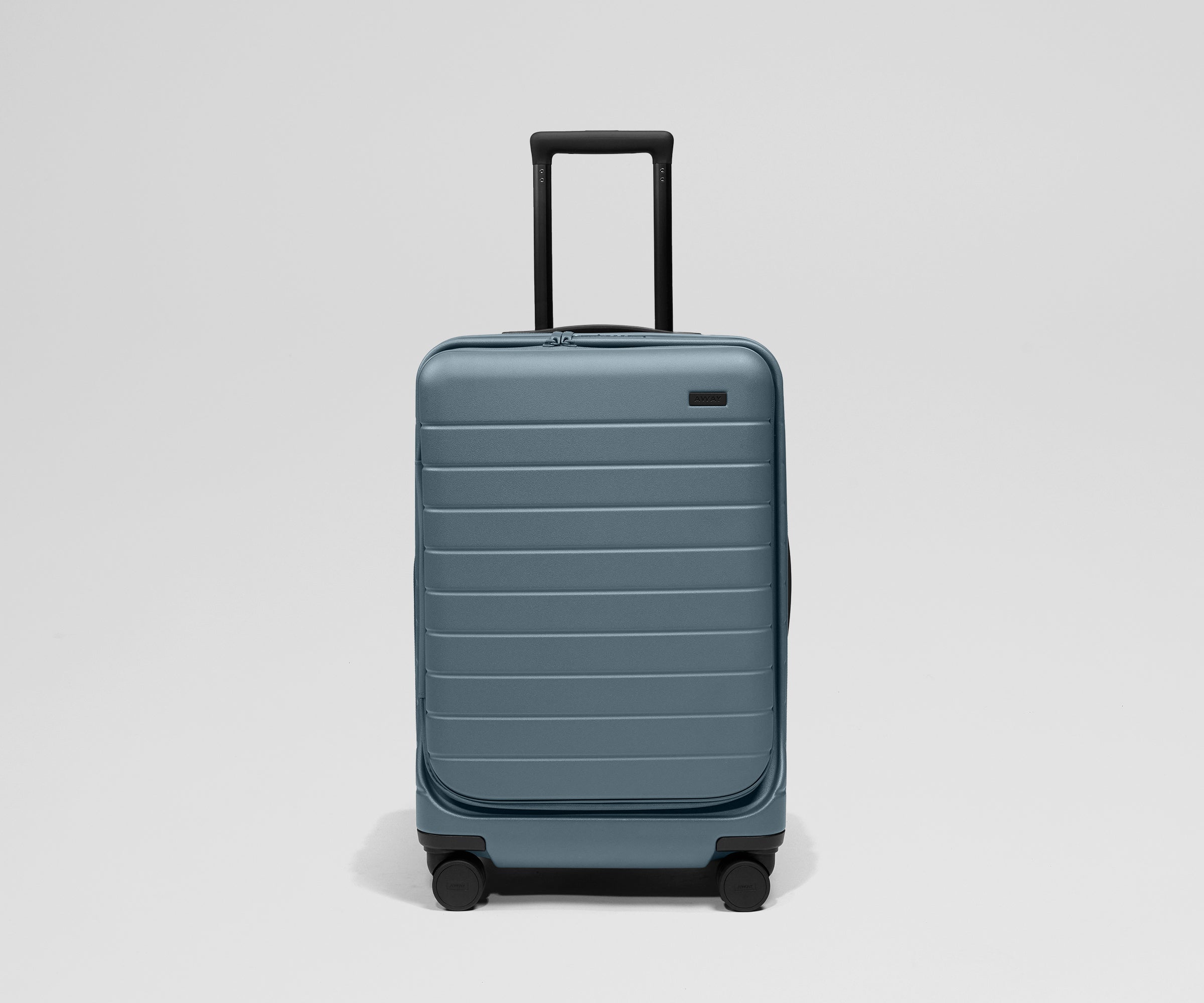 Spacious polycarbonate carry‑on suitcase for 4‑7‑day trips, with laptop sleeve, expandable zip, smooth 360° wheels and rear‑wheel brake.