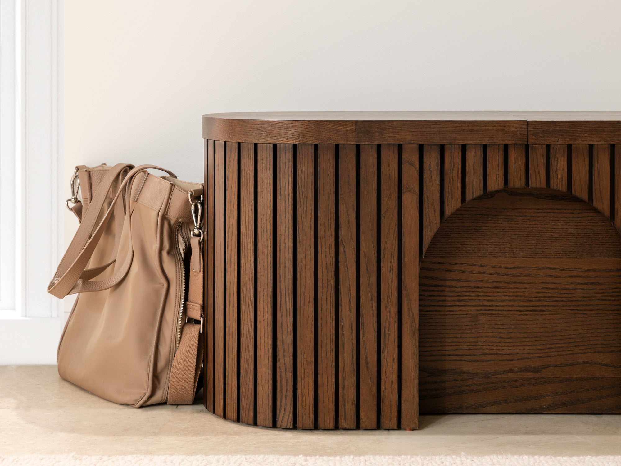 Practical extendable round dining set; storage‑built bench holds extra panels, robust hardwood build, smooth gliding rails and matching premium finishes.