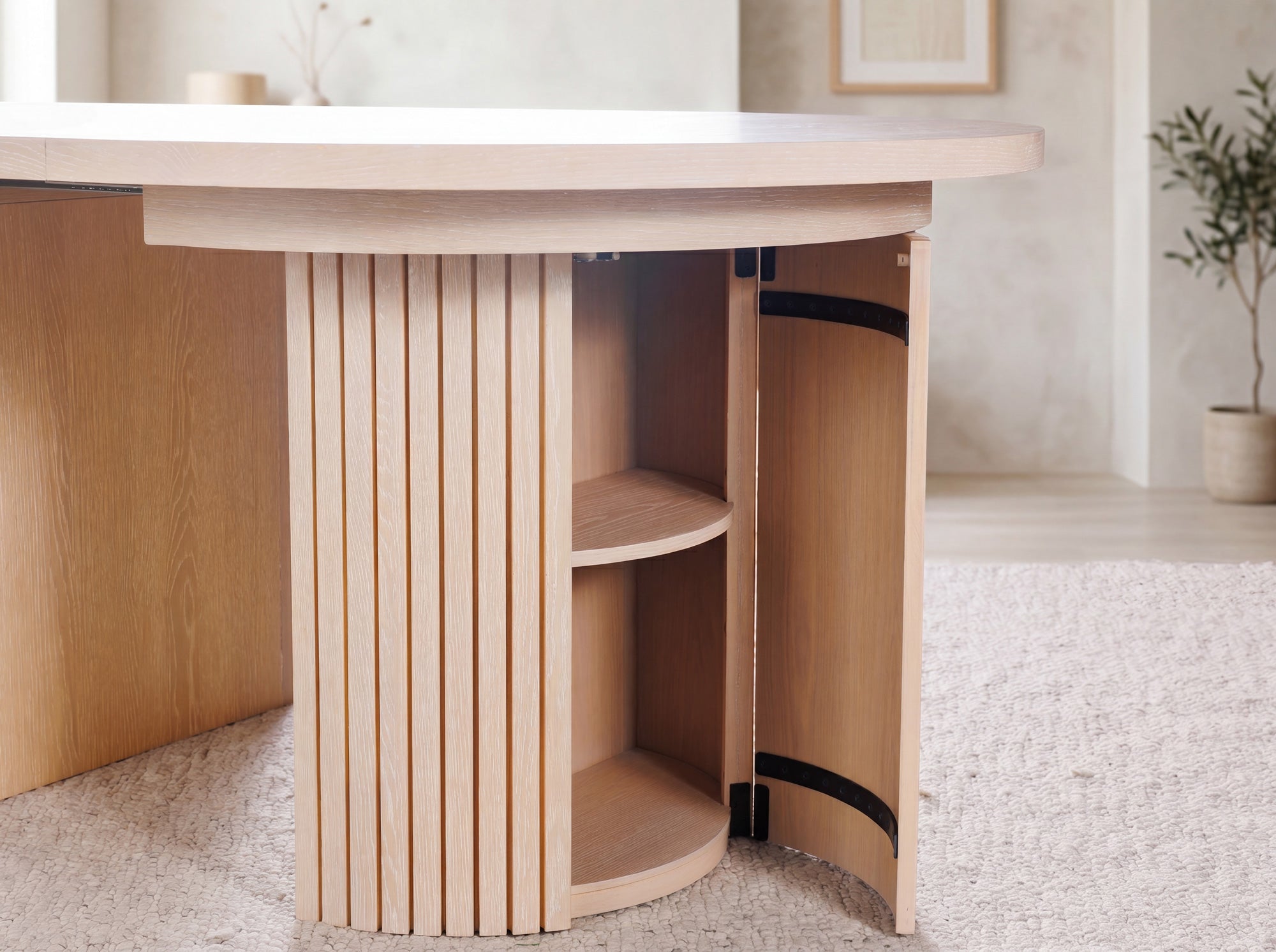 Versatile expandable dining table seats 4‑10, robust hardwood‑steel build, hidden pedestal storage and elegant fluted detailing for flexible everyday dining.