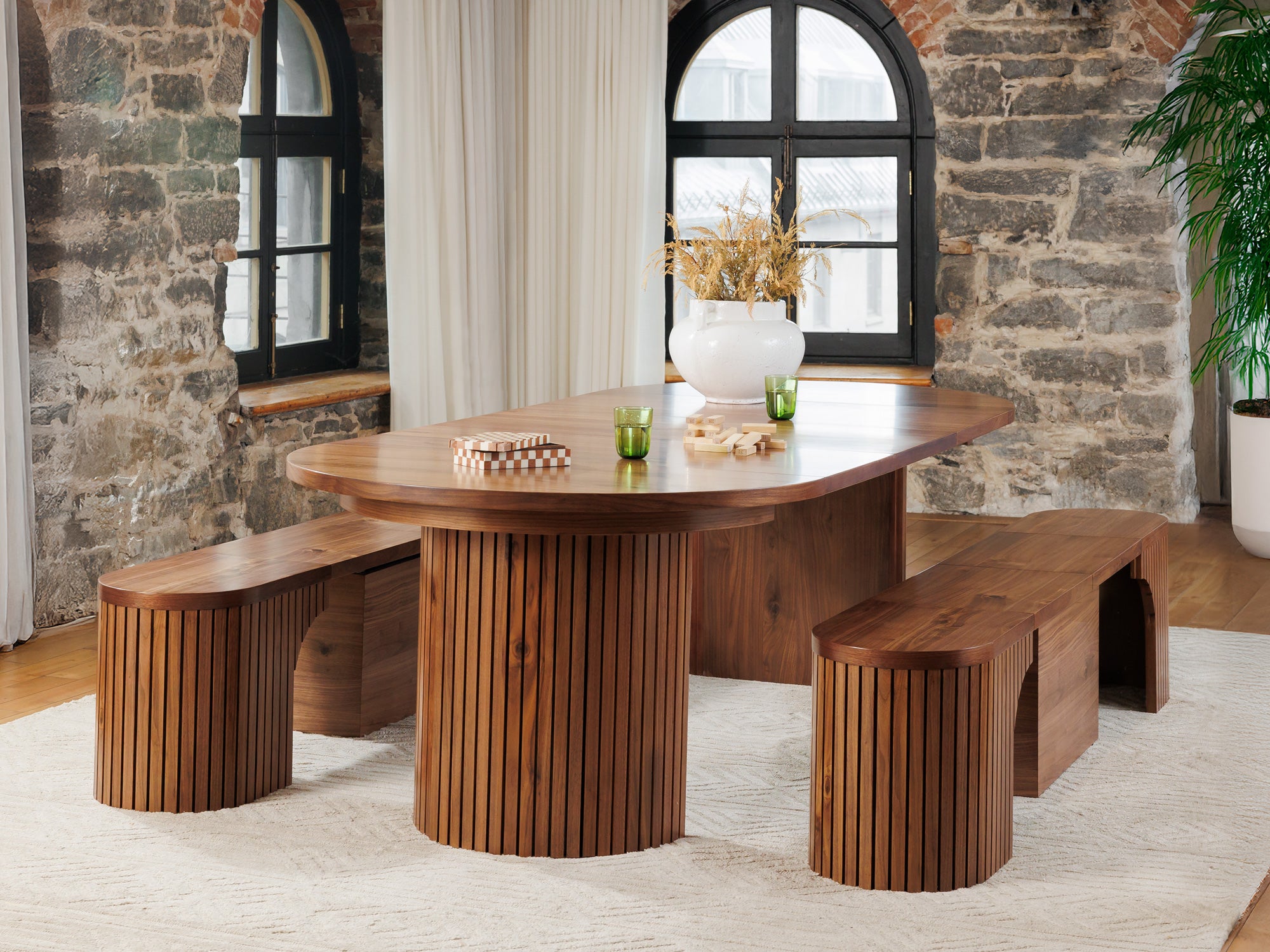 Practical extendable round dining set; storage‑built bench holds extra panels, robust hardwood build, smooth gliding rails and matching premium finishes.