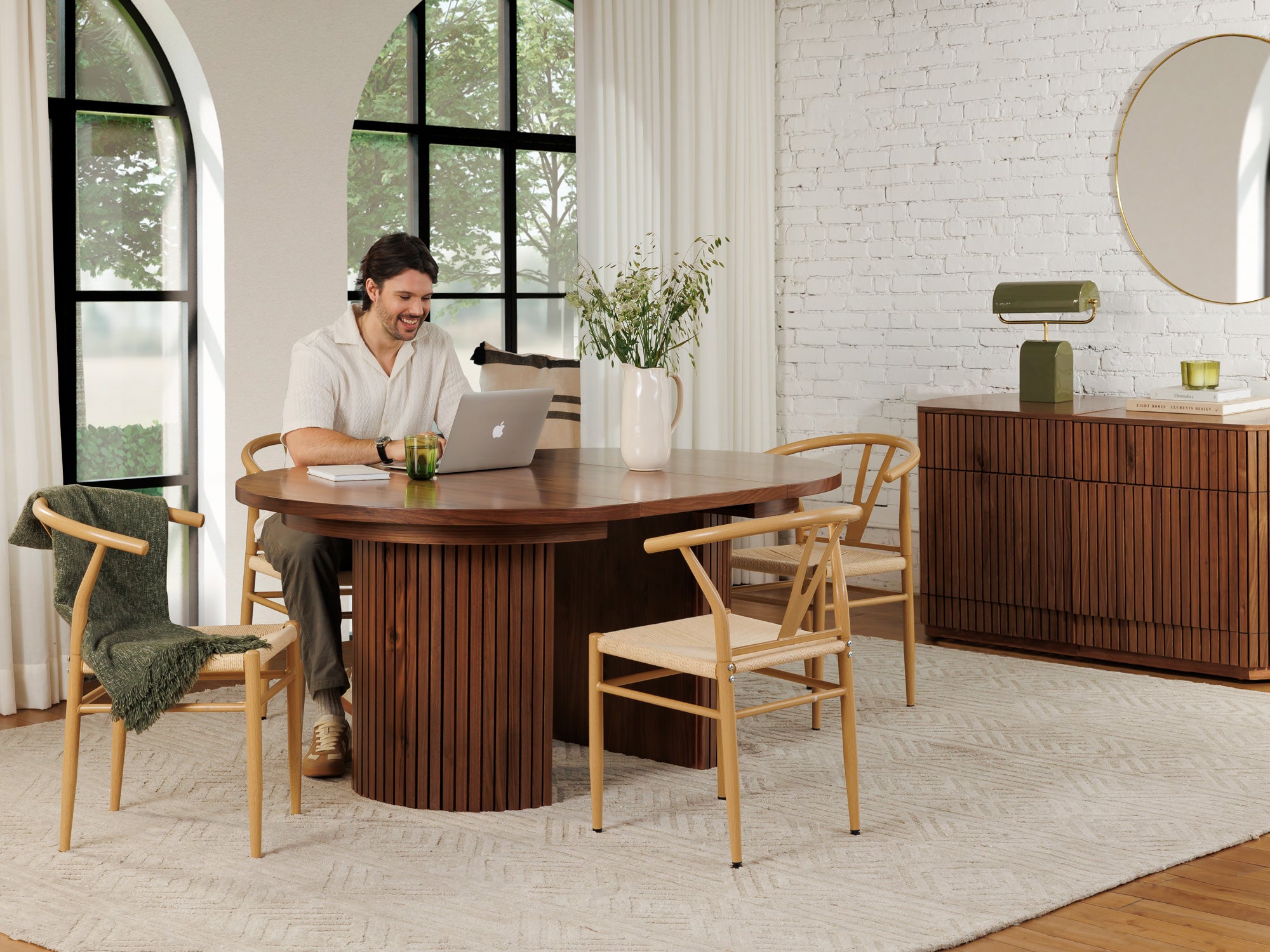 Versatile expandable dining table seats 4‑10, robust hardwood‑steel build, hidden pedestal storage and elegant fluted detailing for flexible everyday dining.
