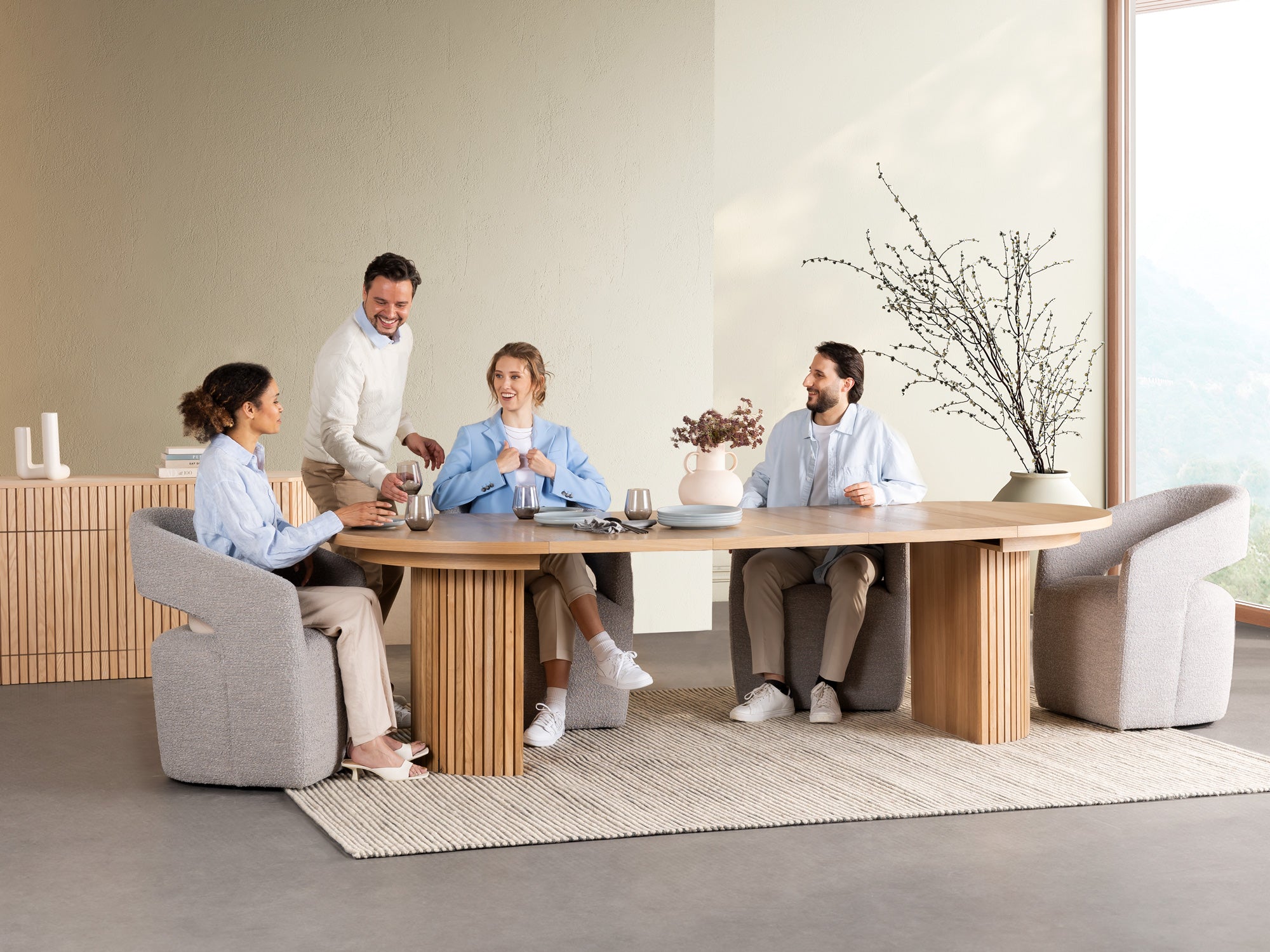 Versatile expandable dining table seats 4‑10, robust hardwood‑steel build, hidden pedestal storage and elegant fluted detailing for flexible everyday dining.