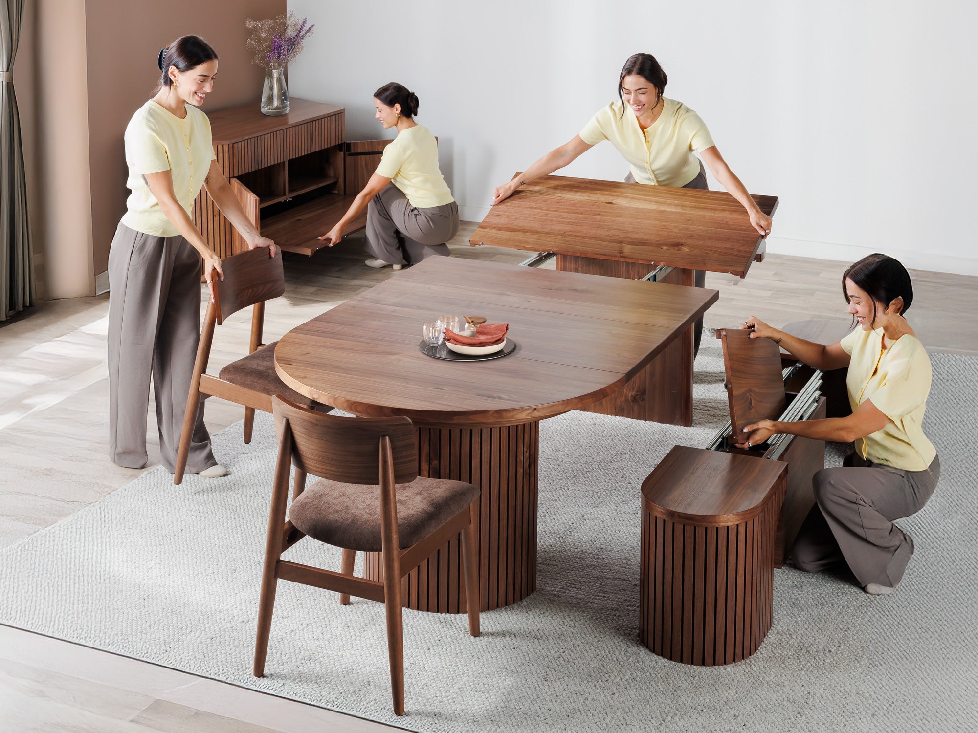 Versatile expandable dining table seats 4‑10, robust hardwood‑steel build, hidden pedestal storage and elegant fluted detailing for flexible everyday dining.