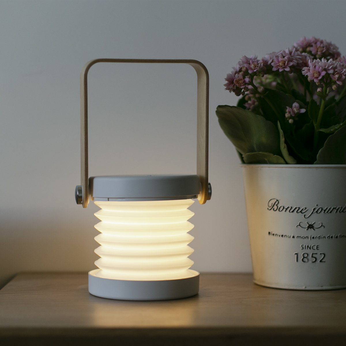 Transformable USB‑rechargeable lamp with touch dimming and 360° rotation, portable cord‑free lighting for indoor and outdoor use.