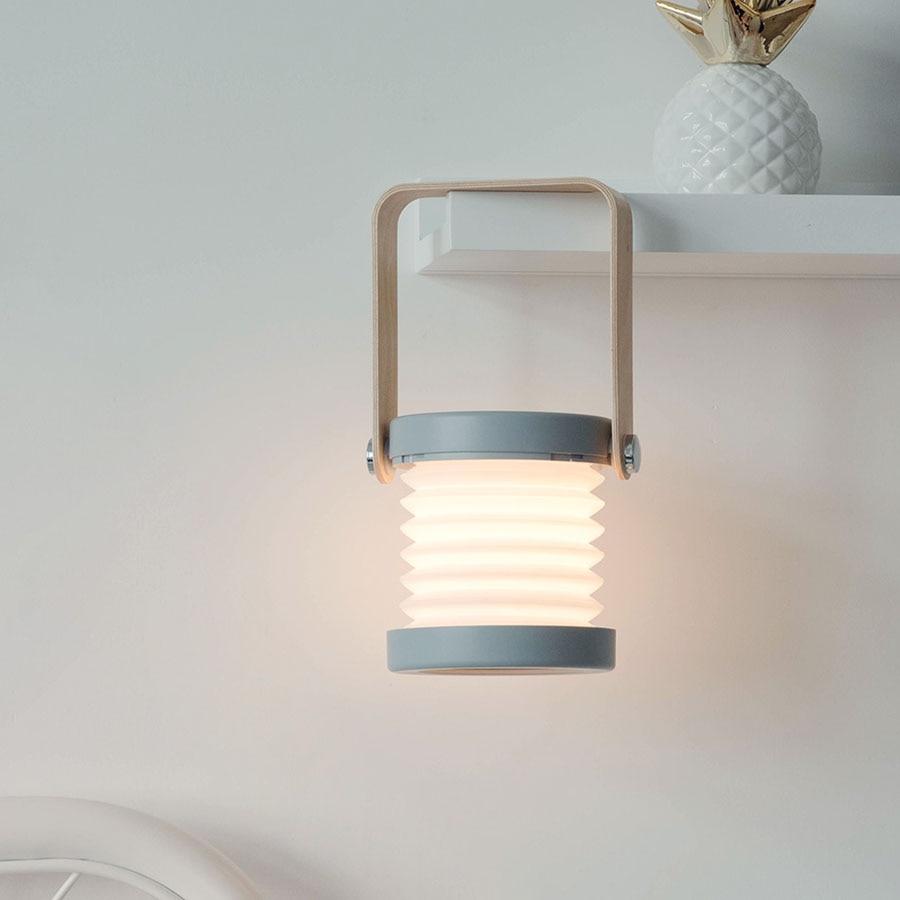 Transformable USB‑rechargeable lamp with touch dimming and 360° rotation, portable cord‑free lighting for indoor and outdoor use.
