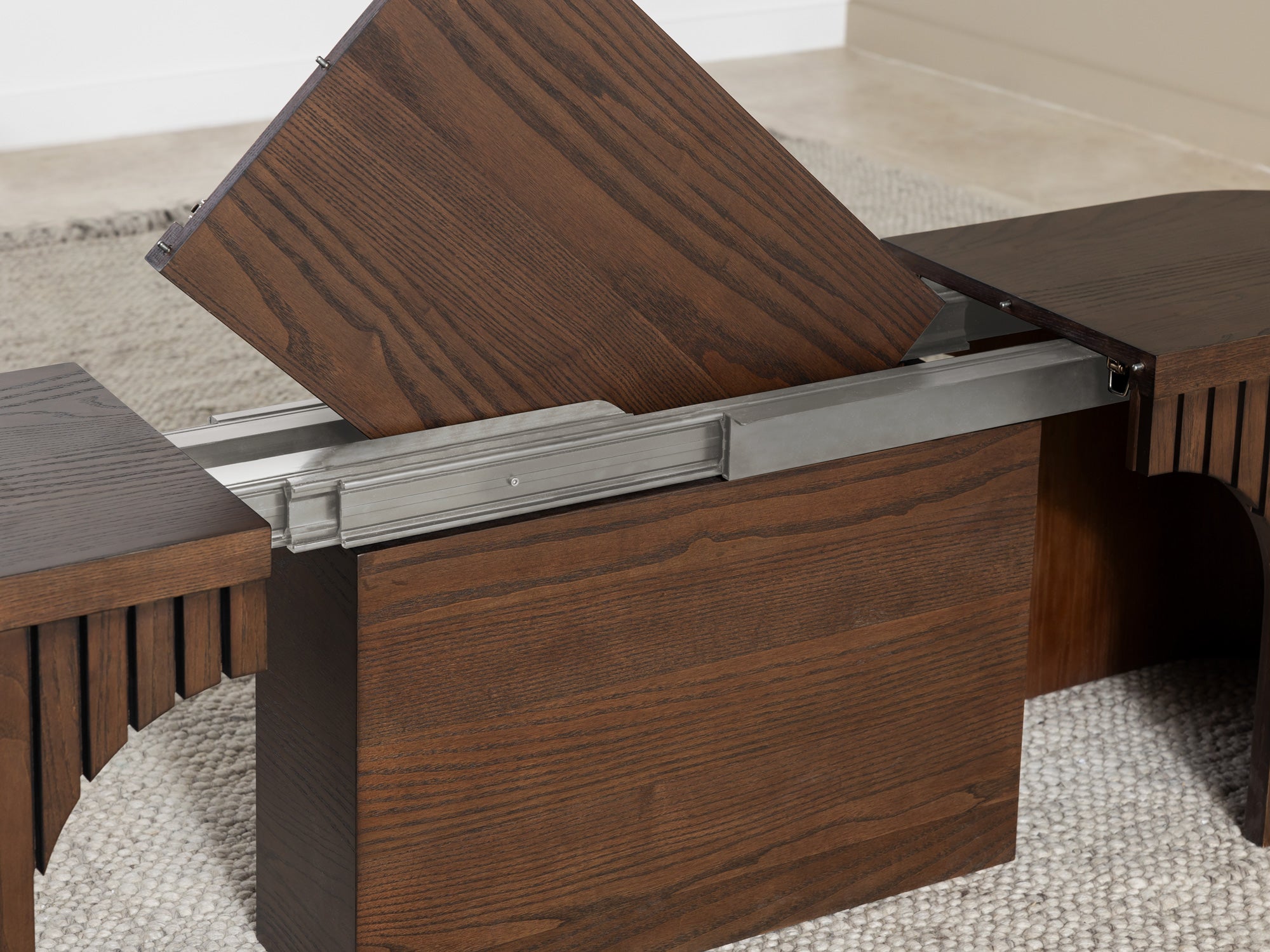 Practical extendable round dining set; storage‑built bench holds extra panels, robust hardwood build, smooth gliding rails and matching premium finishes.
