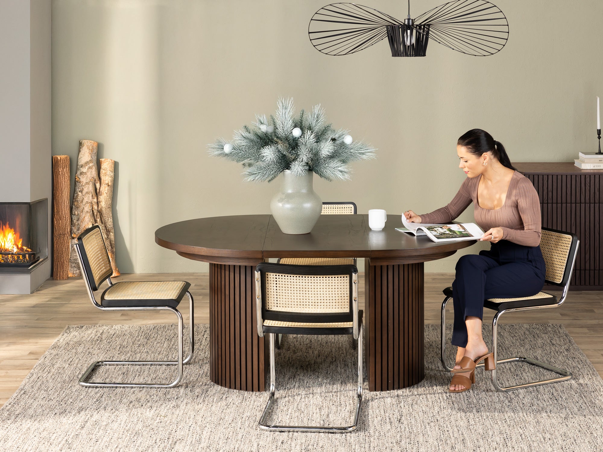 Versatile expandable dining table seats 4‑10, robust hardwood‑steel build, hidden pedestal storage and elegant fluted detailing for flexible everyday dining.