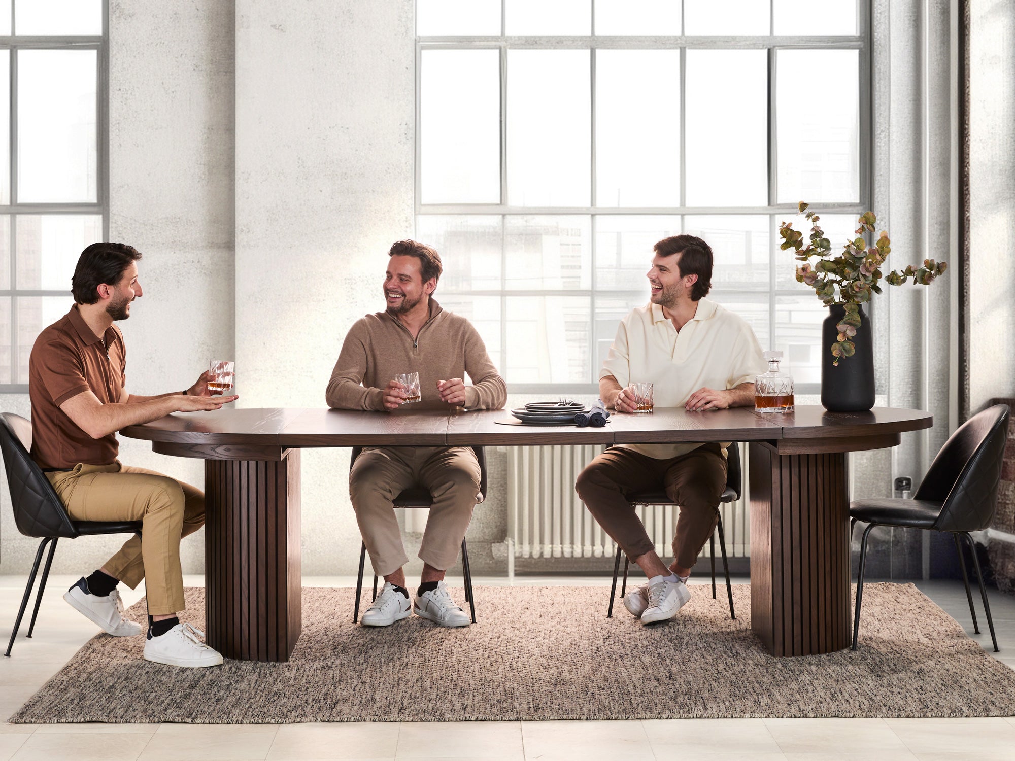 Versatile expandable dining table seats 4‑10, robust hardwood‑steel build, hidden pedestal storage and elegant fluted detailing for flexible everyday dining.