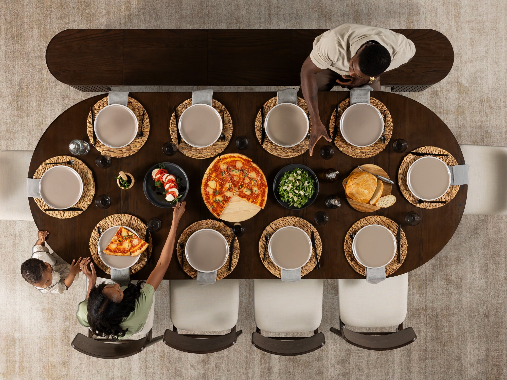 Practical extendable round dining set; storage‑built bench holds extra panels, robust hardwood build, smooth gliding rails and matching premium finishes.