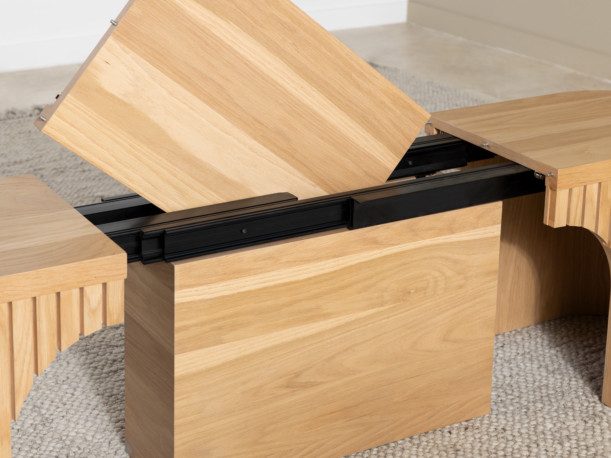 Practical extendable round dining set; storage‑built bench holds extra panels, robust hardwood build, smooth gliding rails and matching premium finishes.