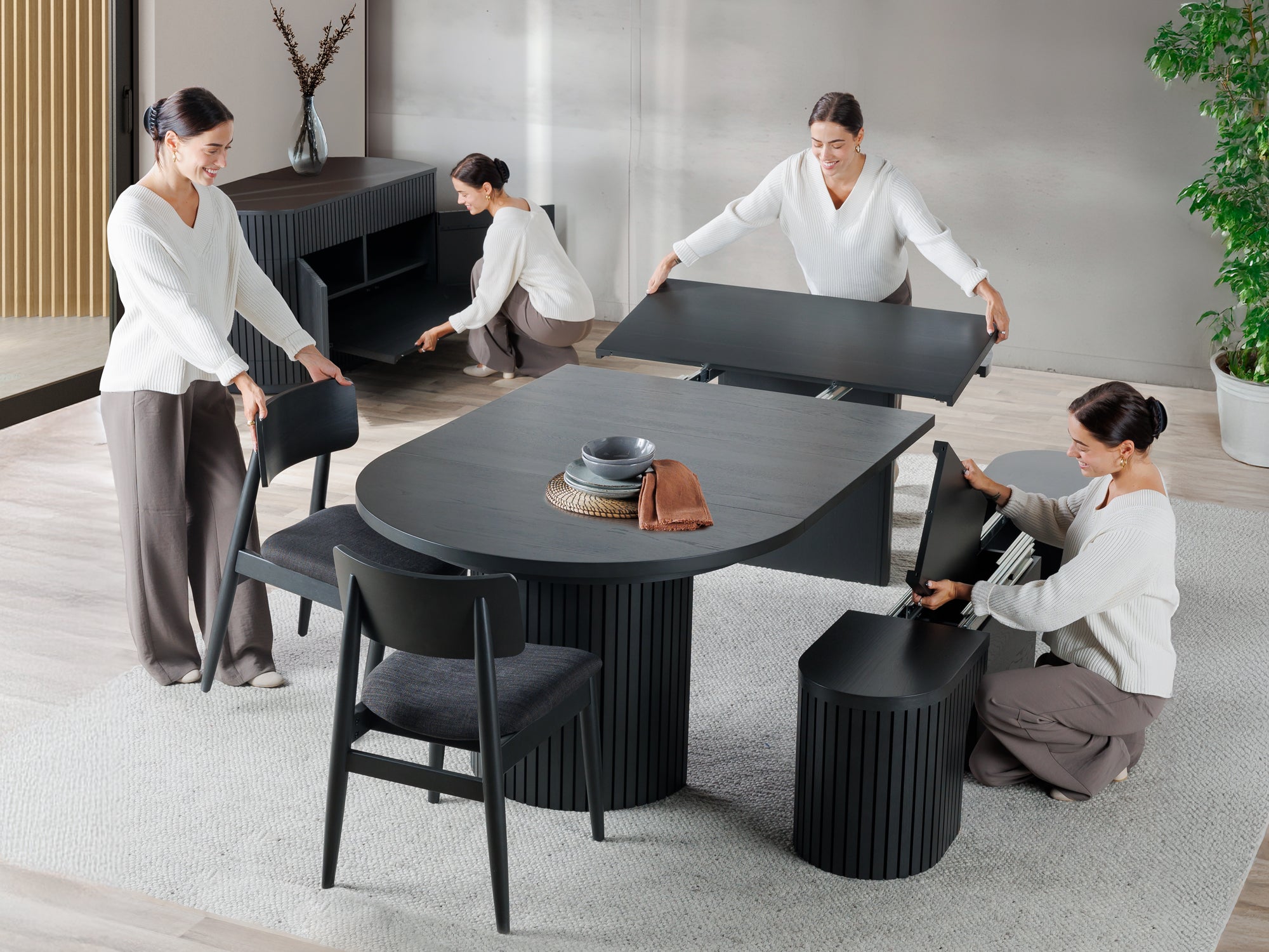 Versatile expandable dining table seats 4‑10, robust hardwood‑steel build, hidden pedestal storage and elegant fluted detailing for flexible everyday dining.