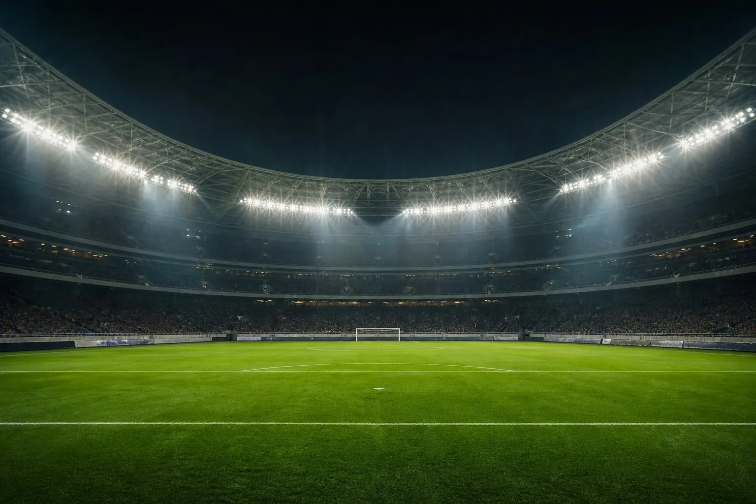 Dramatic empty world class soccer stadium at night under bright floodlights