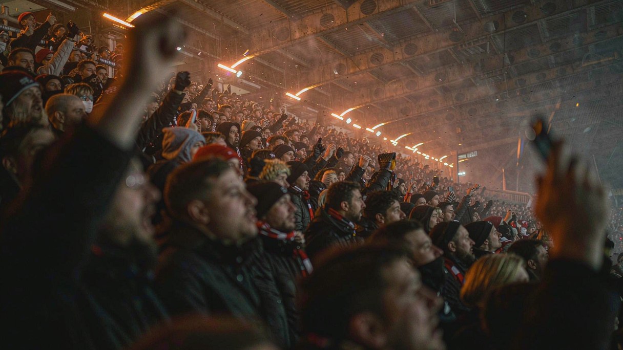 Supporters on a terrace during a Thursday night UEFA Europa League match