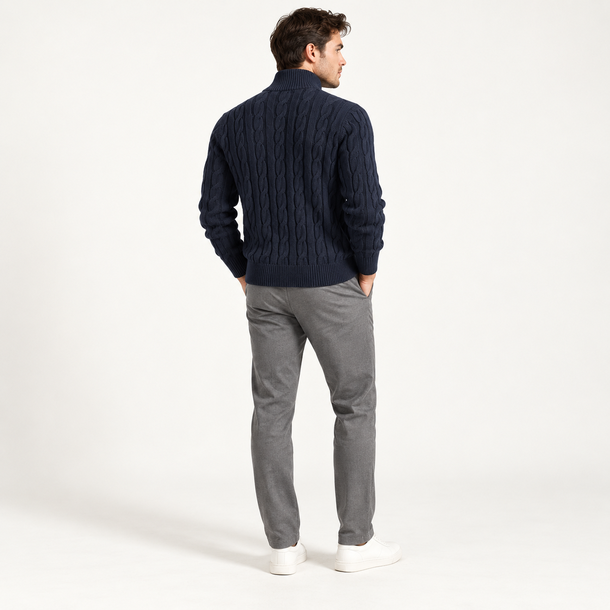 Male model showing the cable-knit back of the Navy quarter-zip sweater