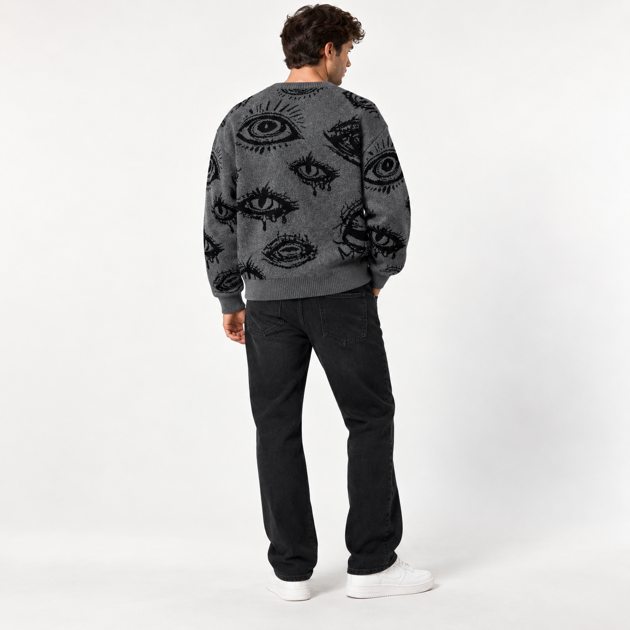 Young male model showing the back of a Charcoal Gray eye graphic sweater