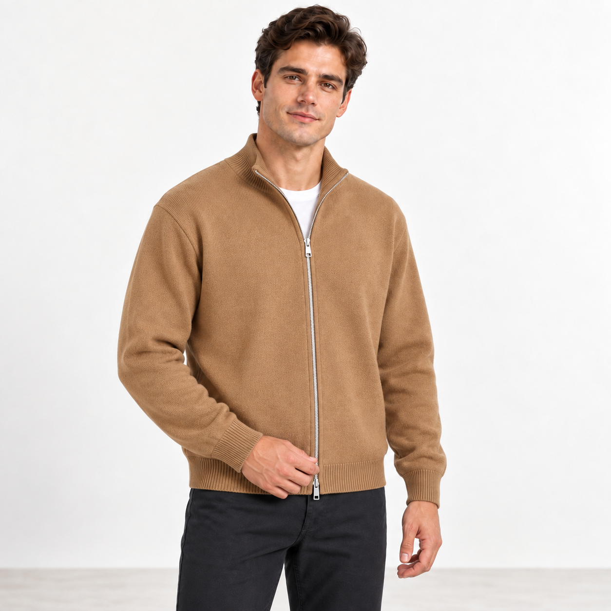 American male model wearing the Camel full-zip cardigan in a natural three-quarter studio pose