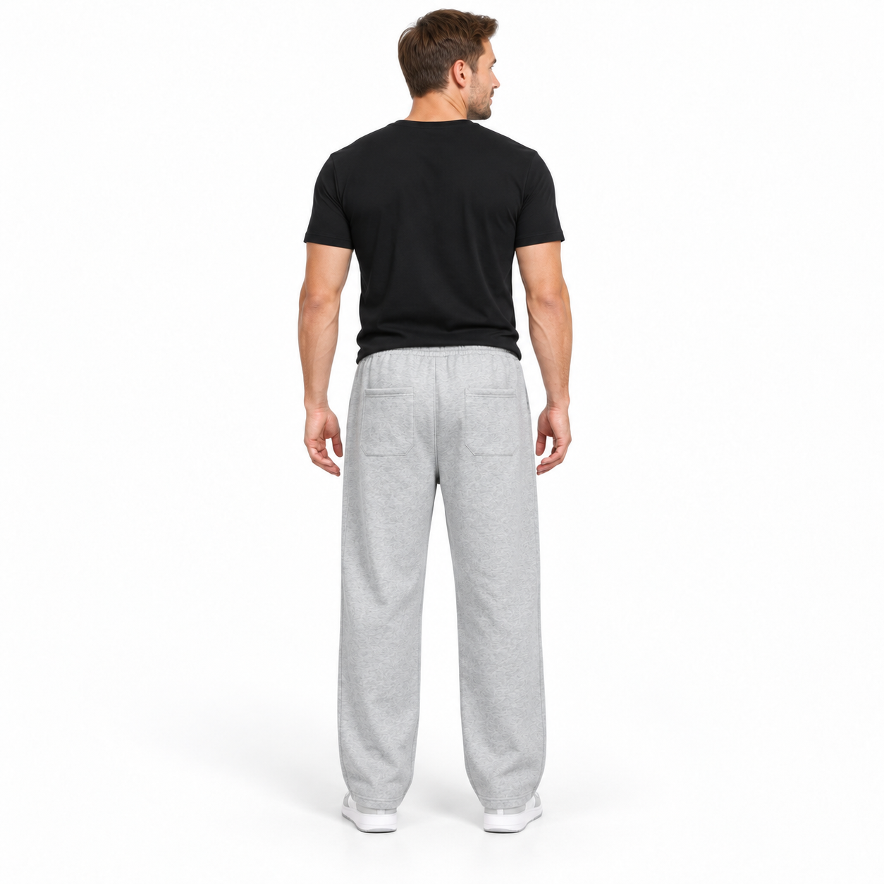 Man wearing Heather Grey heavyweight loose straight-leg pants, studio back view with two patch pockets