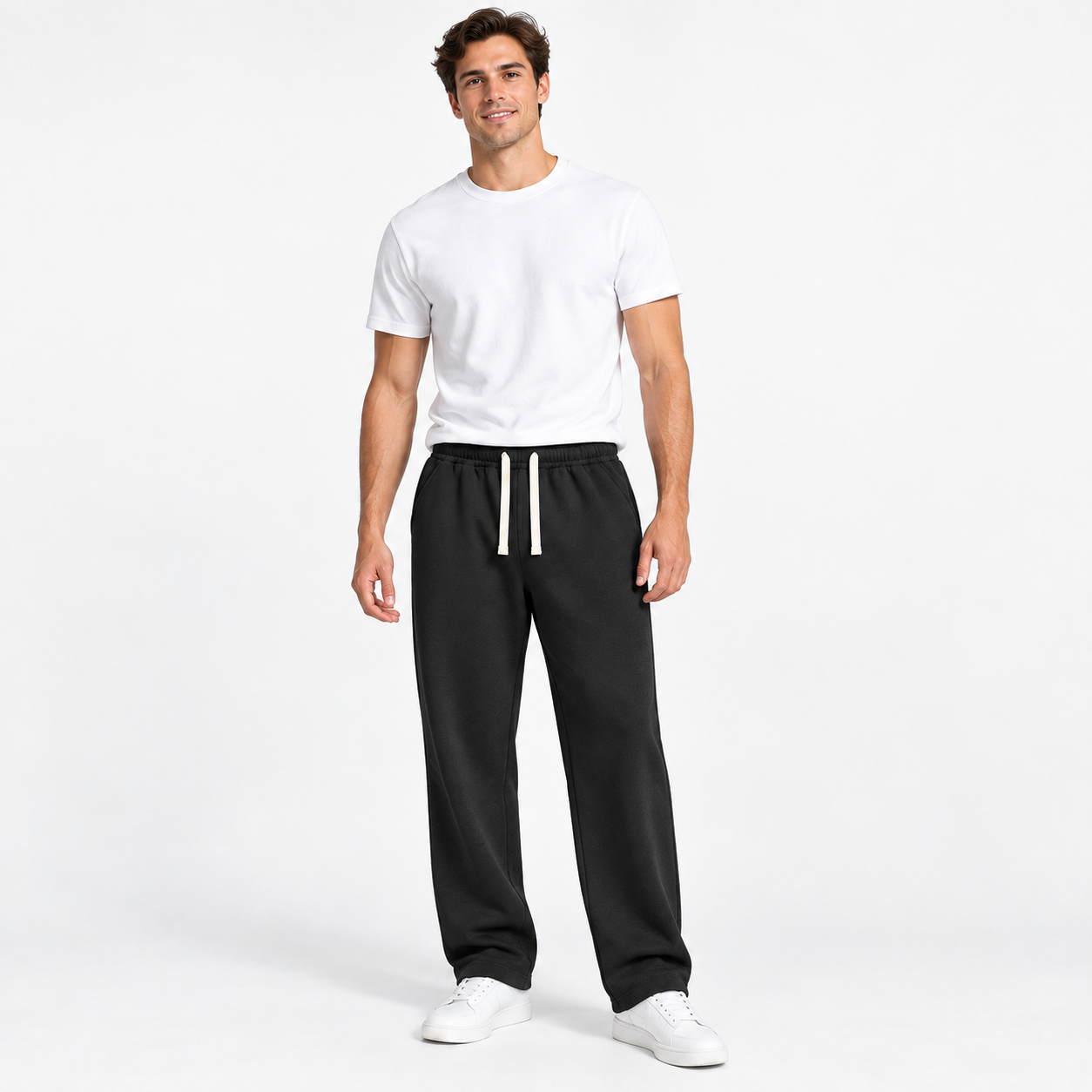 American male model wearing Black relaxed straight-leg sweatpants in a clean studio, front view