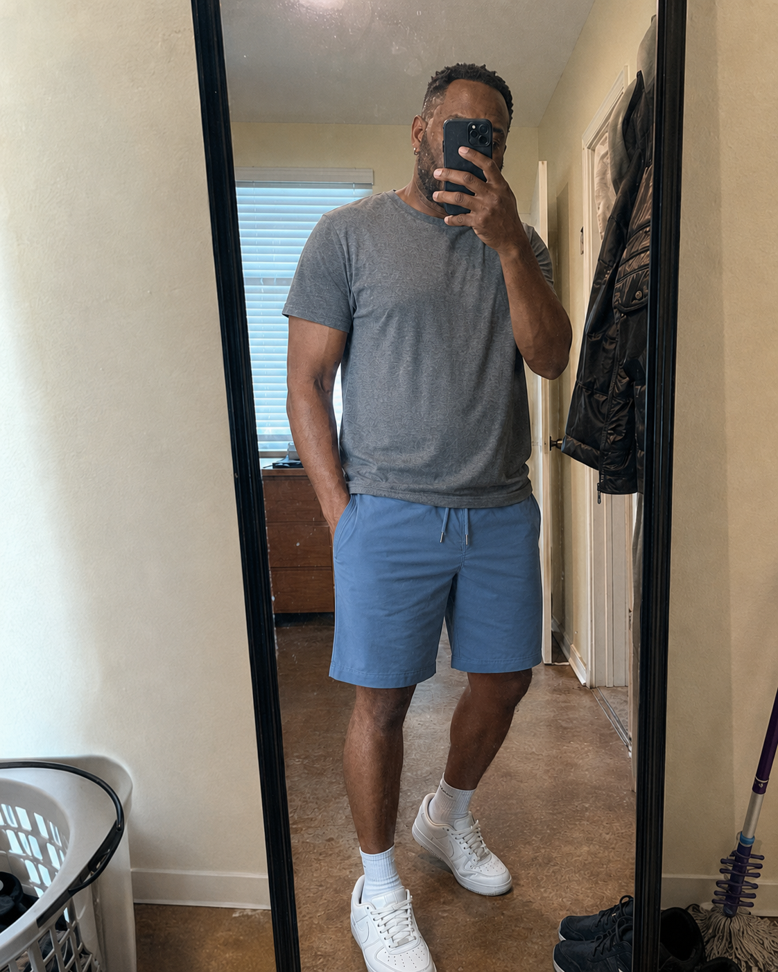 Denim blue drawstring shorts in a casual mirror-style photo