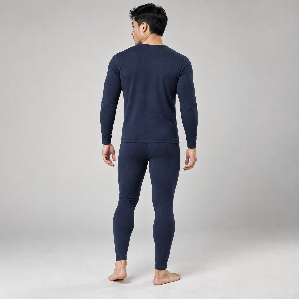 Navy fleece-lined thermal underwear set on a male model, complete back studio view