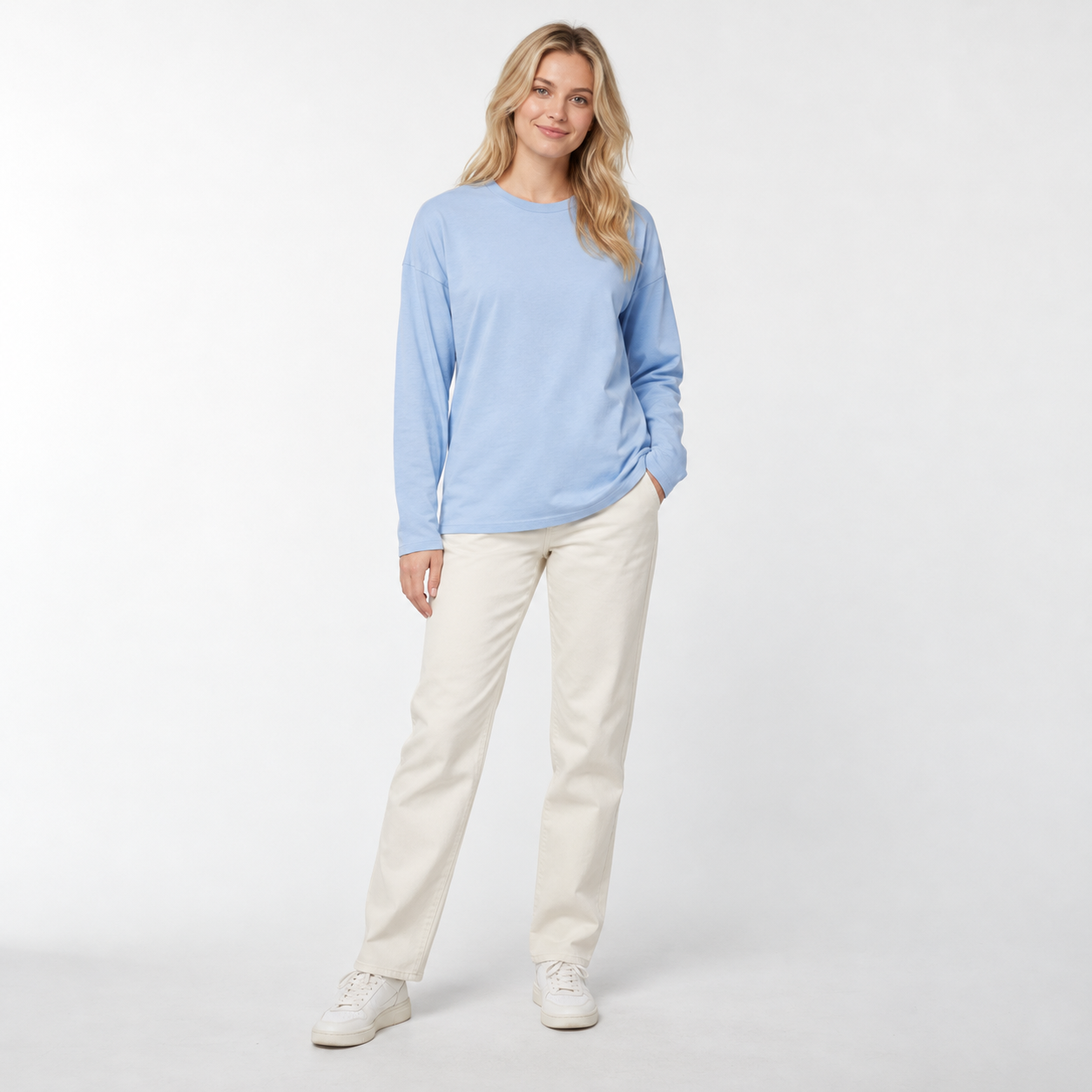 Female model wearing Powder Blue relaxed-fit cotton long sleeve T-shirt, studio front view