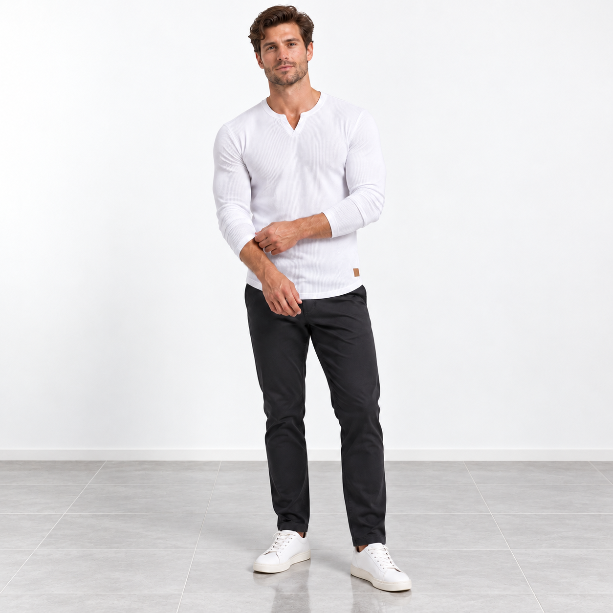 Male model wearing White slim-fit long-sleeve ribbed V-neck T-shirt, studio front view