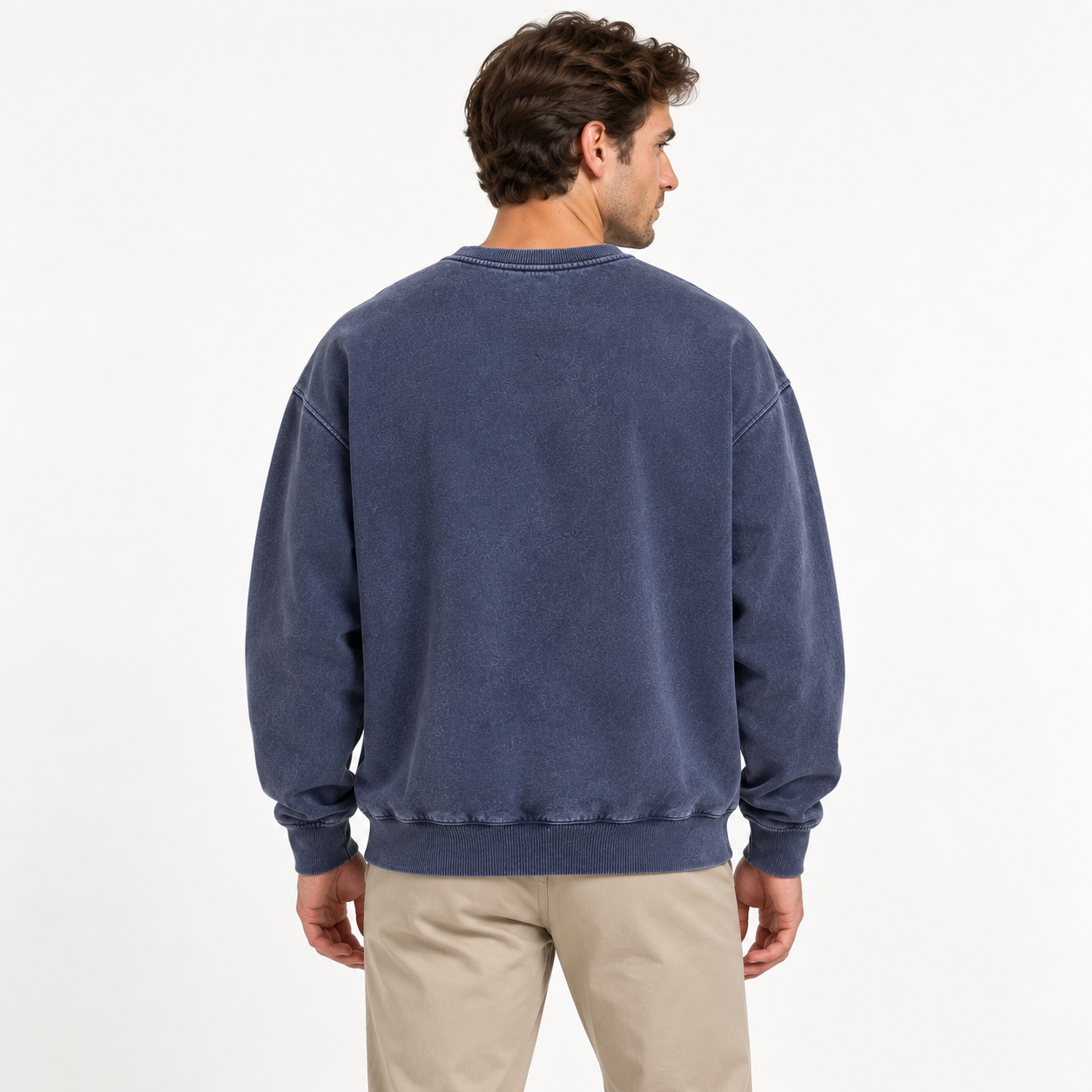 Male model back studio try-on of vintage wash crewneck sweatshirt