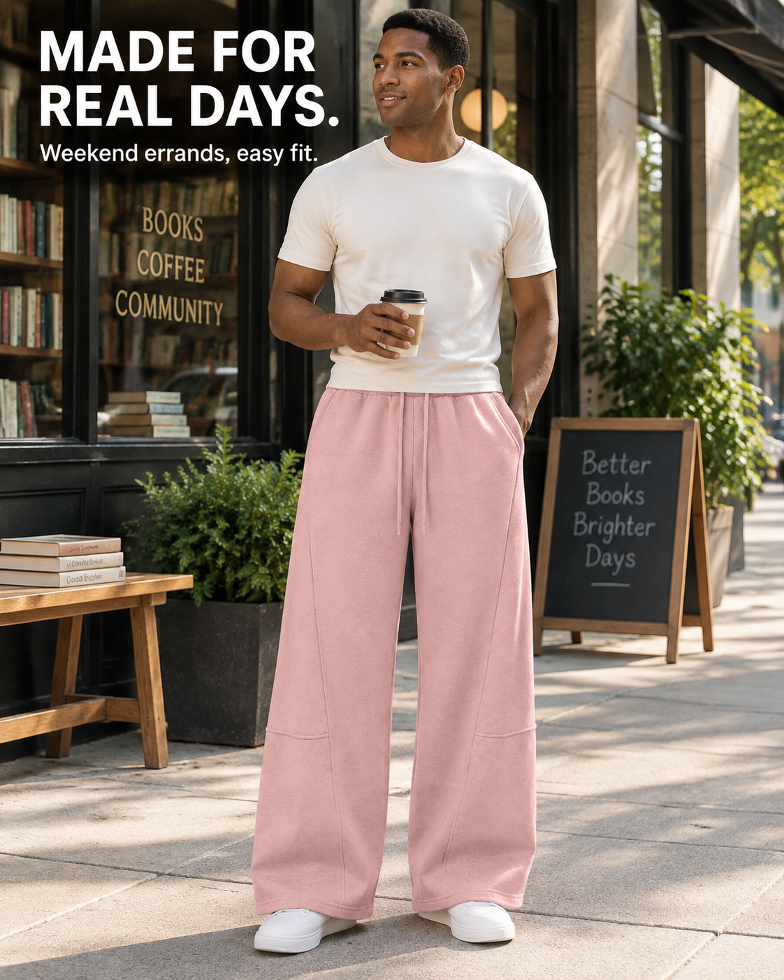 Clean-shaven model wearing solid dusty pink wide-leg sweatpants on a weekend errand