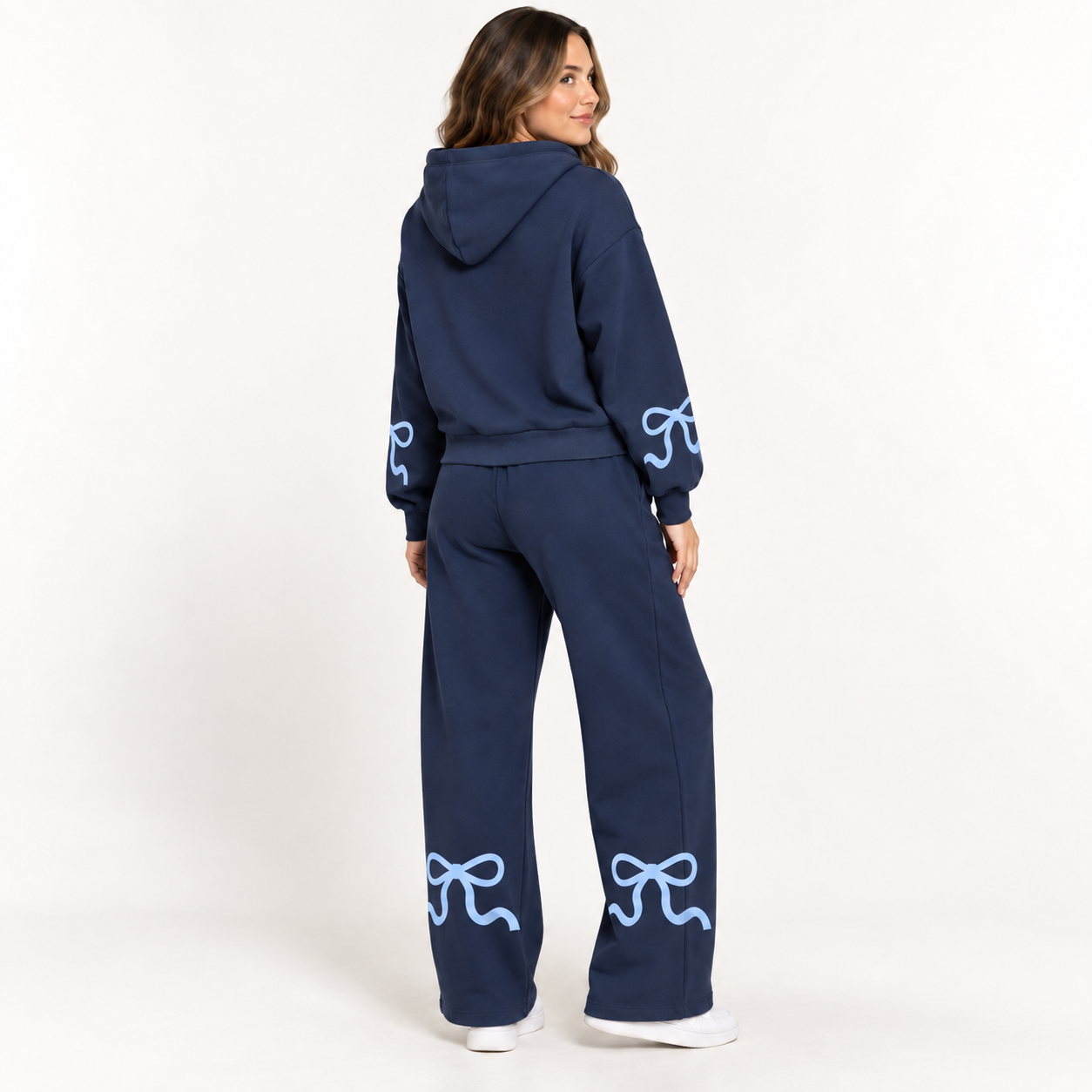 Woman wearing the Deep Navy and Powder Blue set from the back with outer-forearm and rear-lower-leg bows