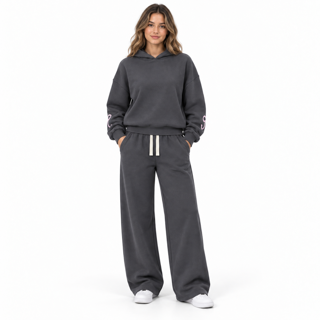 Woman wearing the Charcoal and Blush set from the front with bow-free pant fronts