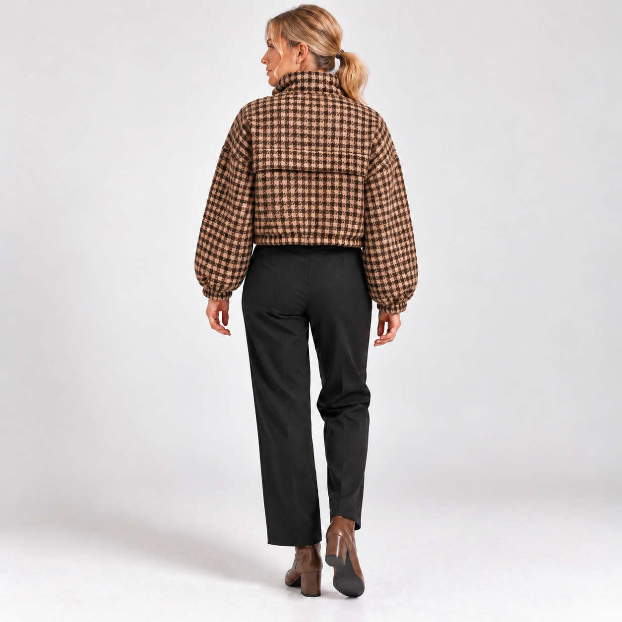 Woman wearing the Coffee Brown cropped houndstooth jacket, clean studio back view without rear drawcords