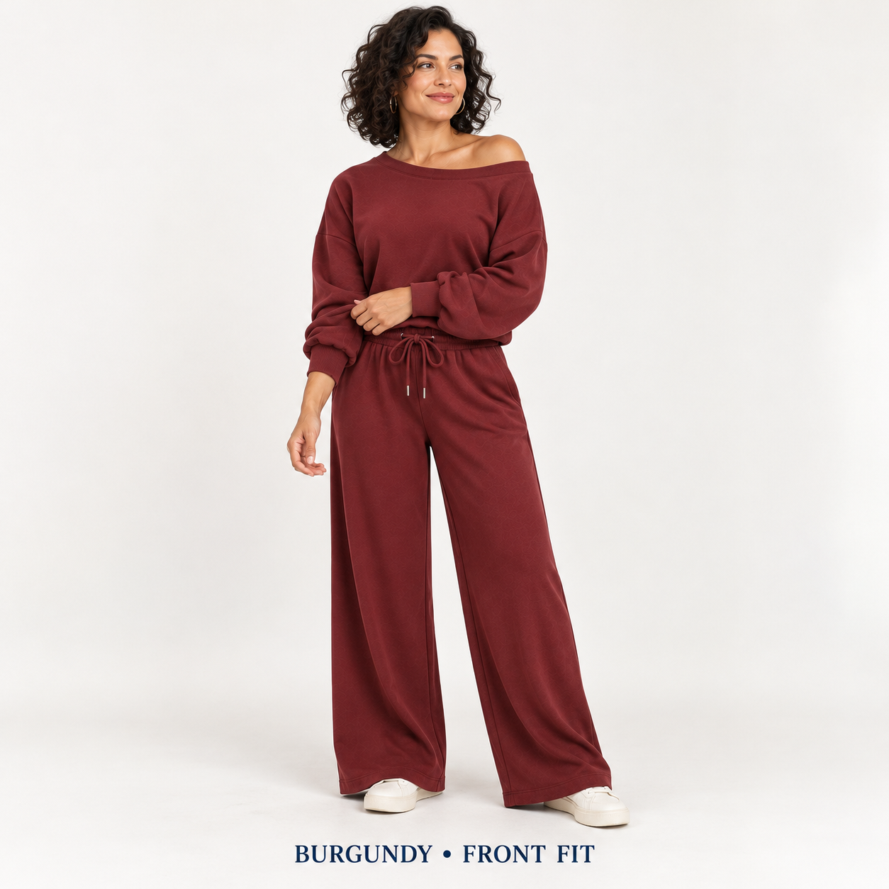 Woman wearing Burgundy off-shoulder wide-leg lounge set, clean studio front view